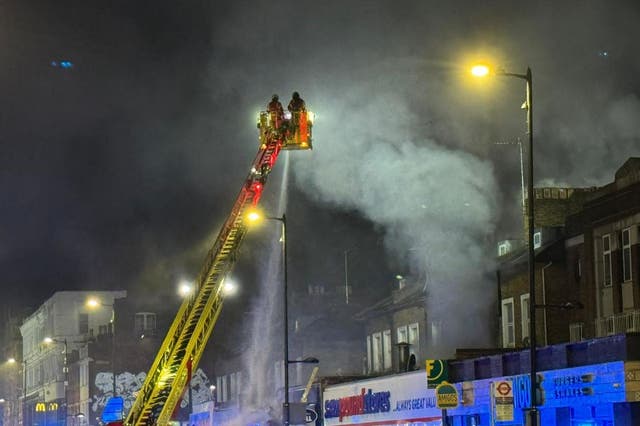 <p>Around 100 firefighters were in attendance at the fire on Seven Sisters Road (London Fire Brigade via Twitter/PA)</p>