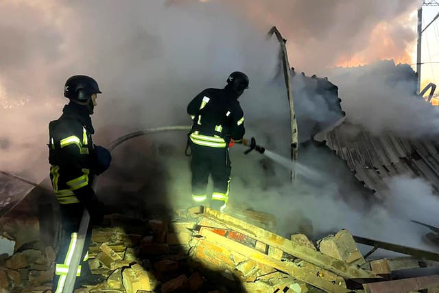 <p>Ukrainian rescuers work to extinguish a fire at an energy infrastructure facility following a missile attack in Lutsk, Volyn region, on Thursday</p>