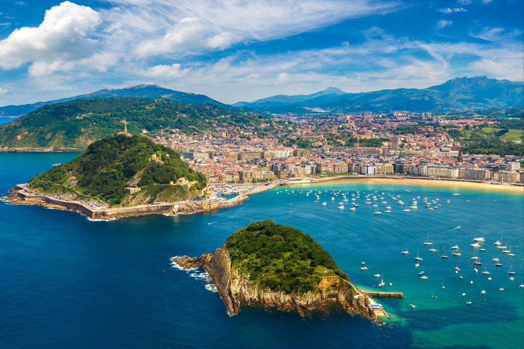 Golden sand and green hillsides border San Sebastian