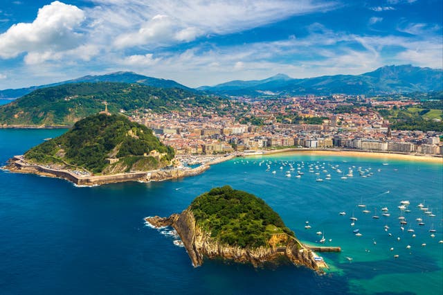 <p>Golden sand and green hillsides border San Sebastian</p>