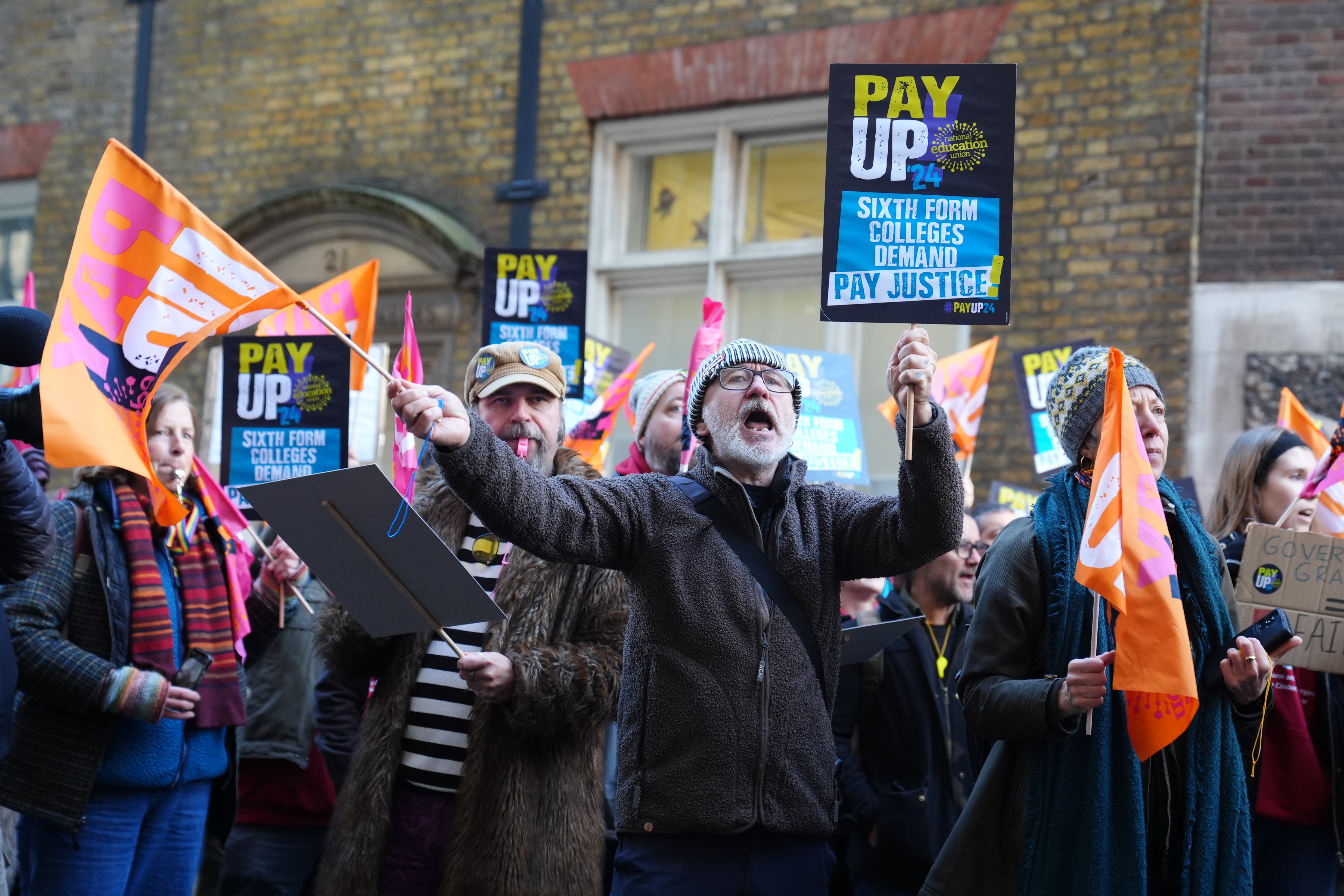 Members of the National Education Union (NEU) hold a rally outside the Department for Education in London (Ben Whitley/PA)