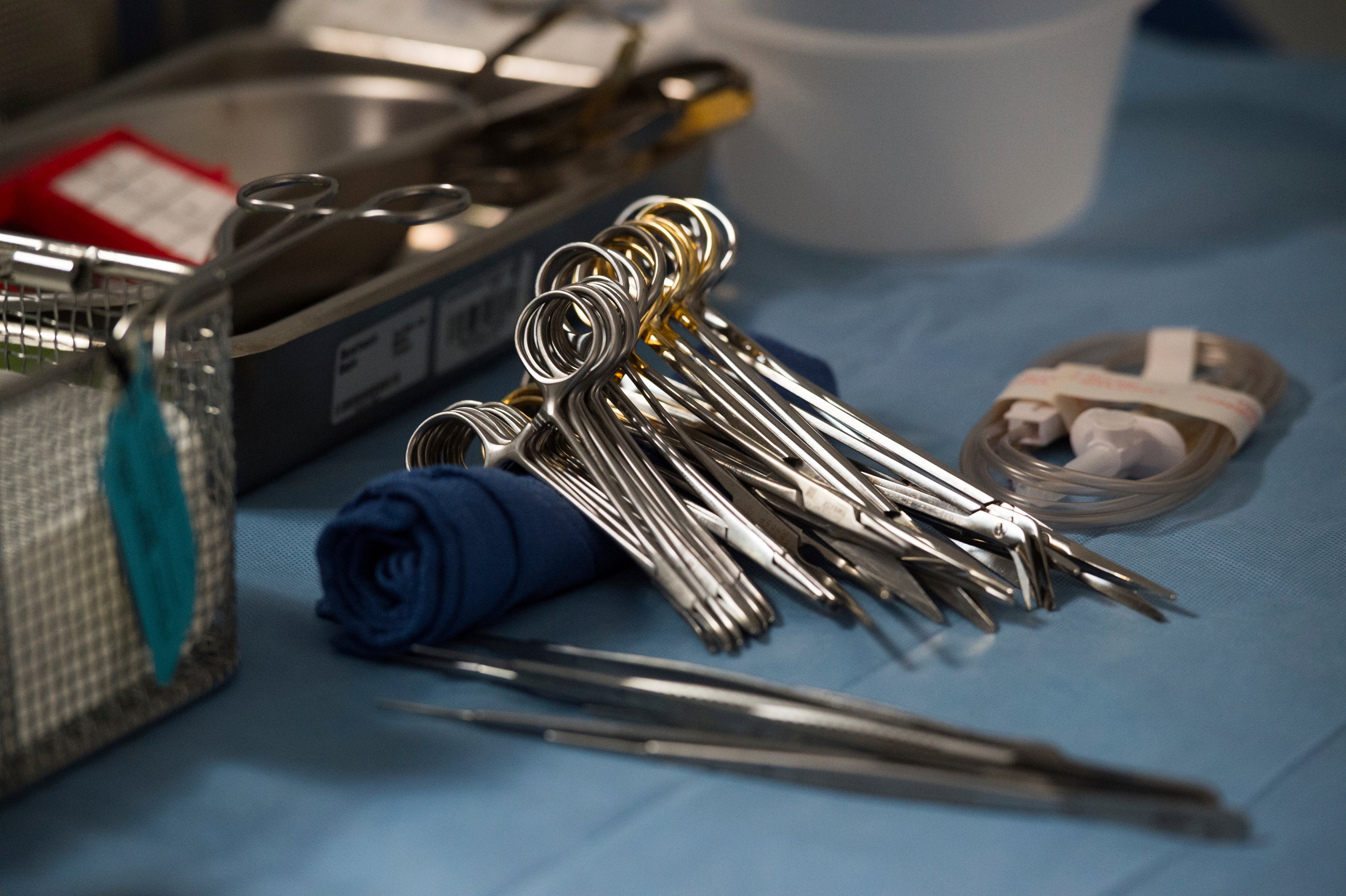 Surgical instruments and supplies lay on a table during a June 2016 kidney transplant surgery at MedStar Georgetown University Hospital in Washington, DC. US health officials announced this week that kidney and liver transplants can now be done between donors and recipients with HIV