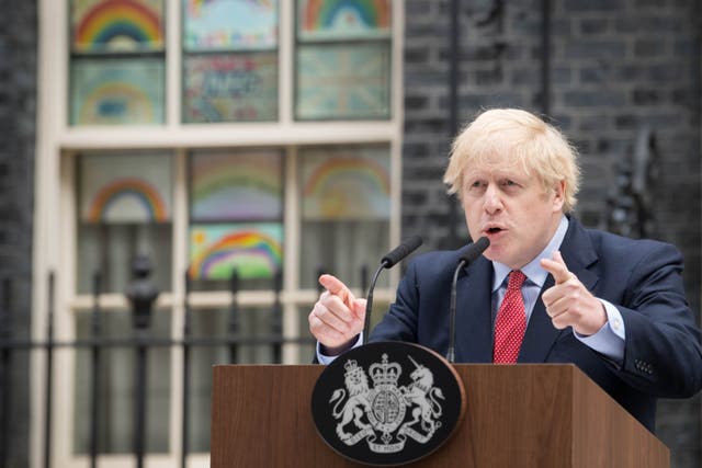 <p>Prime Minister Boris Johnson makes a statement outside 10 Downing Street in April 2020. (Stefan Rousseau/PA)</p>