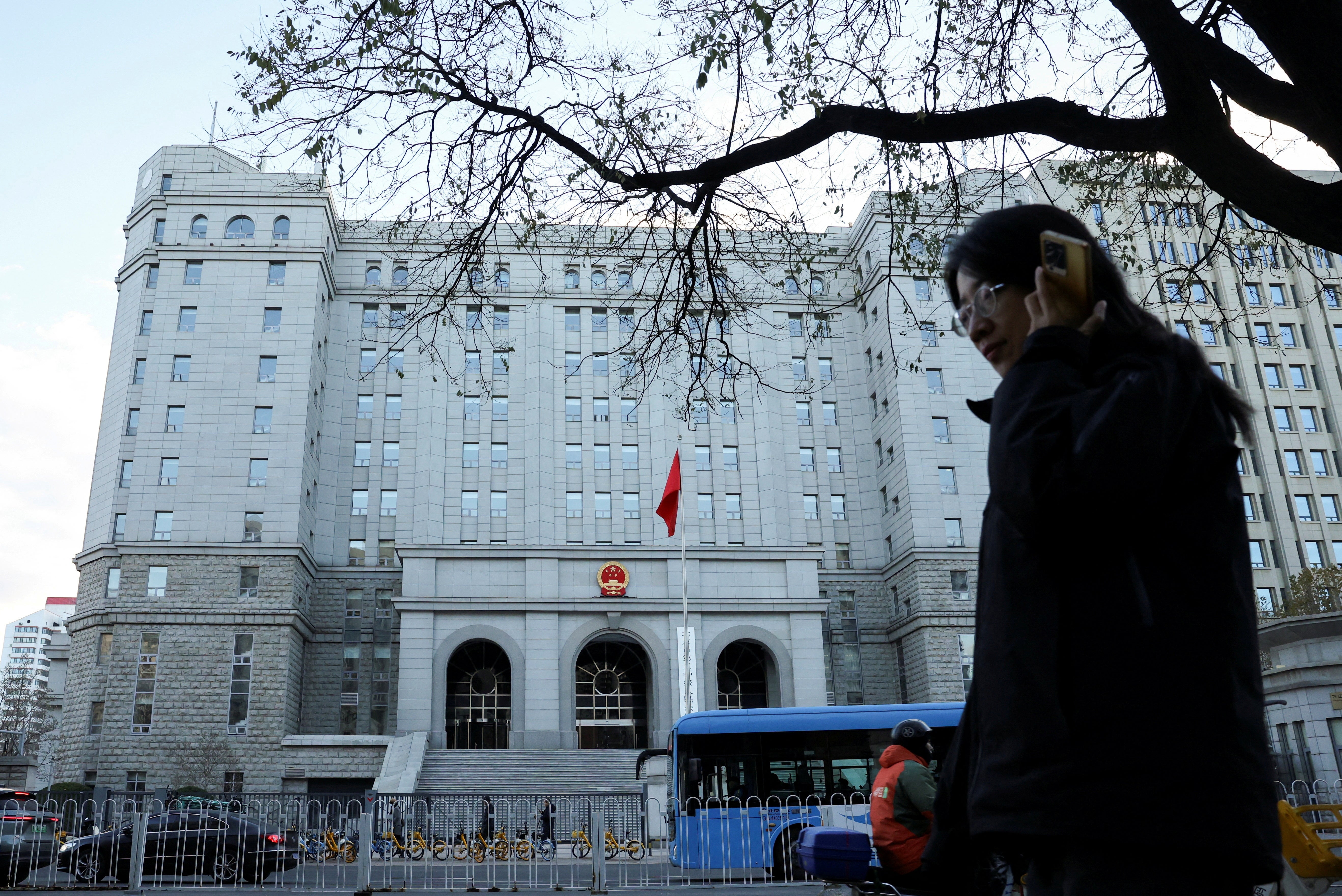 A pedestrian walks past   the Beijing tribunal  wherever  erstwhile  writer  Dong Yuyu received his sentence