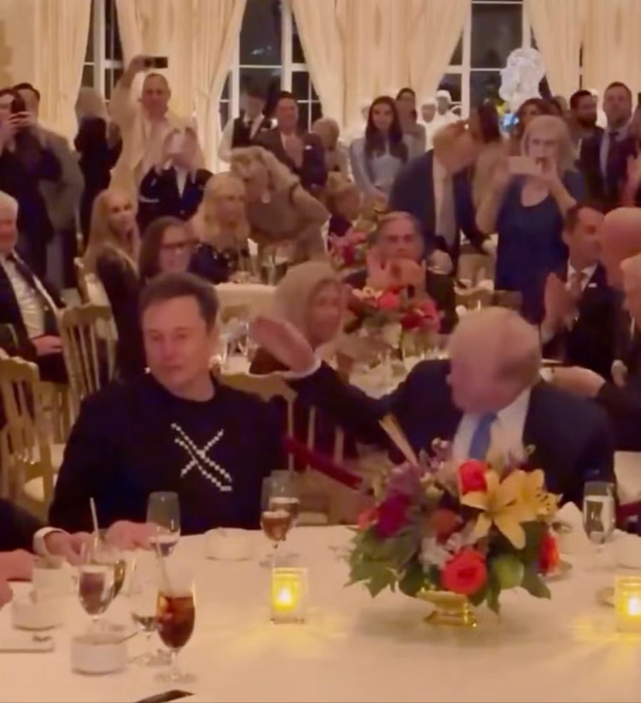 Trump taps Musk on the shoulder as YMCA plays at his Thanksgiving party at Mar-a-Lago