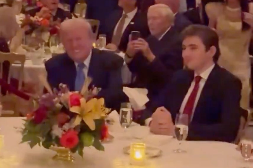 <p>Barron Trump appears to flash an awkward smile as his father and Elon Musk dance to the Village People hit </p>