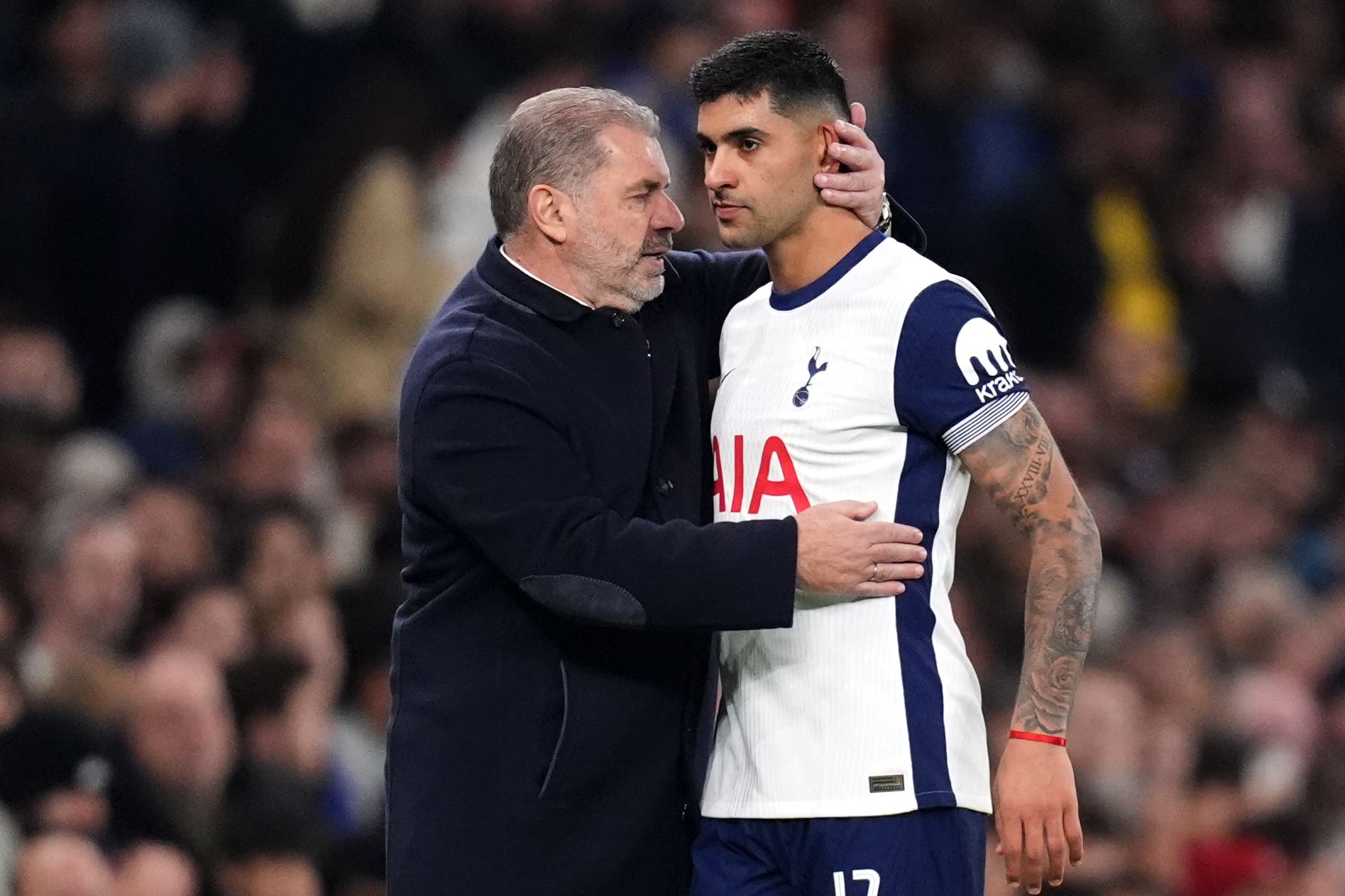 Tottenham manager Ange Postecoglou (left) could have Cristian Romero back in action