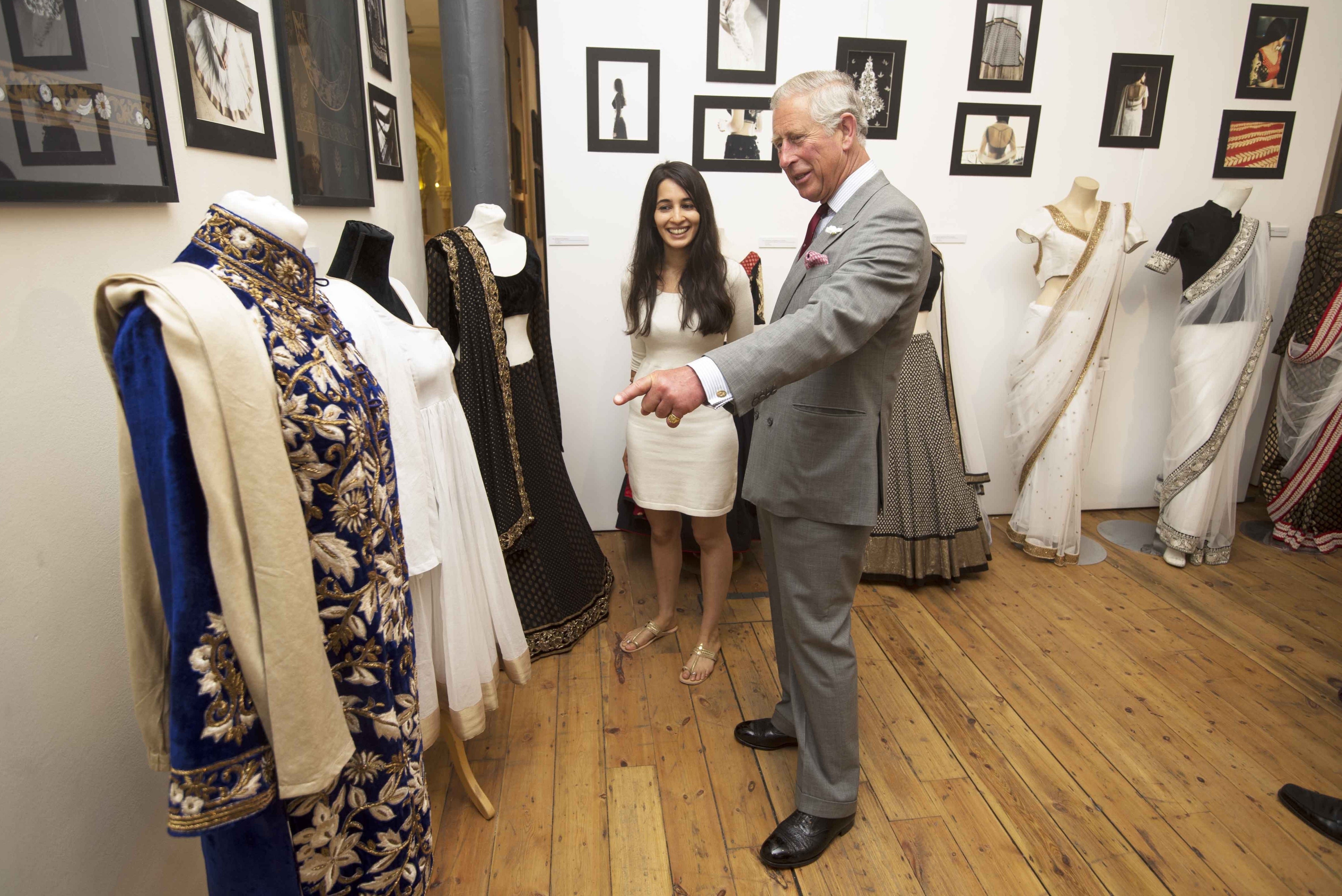 Graduate Anjali Khanna with the then Prince of Wales as he attends the Degree Show at The Prince’s School of Traditional Arts, London