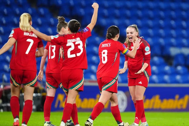 Lily Woodham, right, celebrates scoring for Wales in their Euro 2025 play-off final against the Republic of Ireland (David Davies/PA)