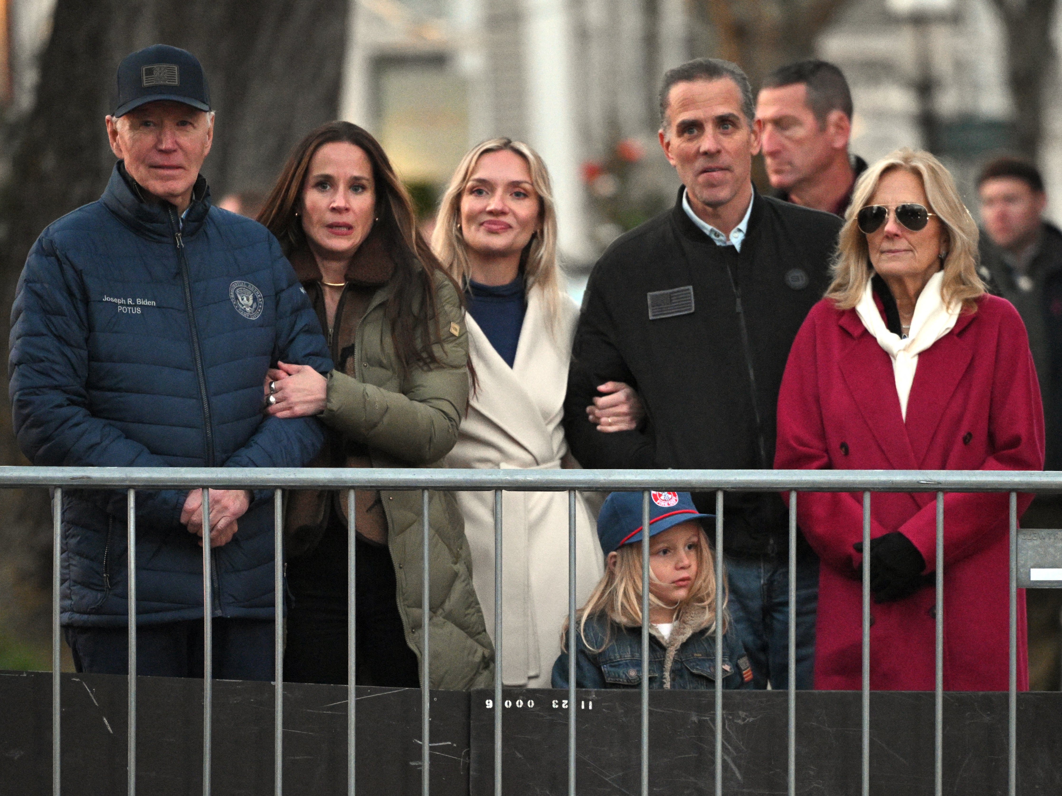 President Joe Biden (L) stands with (from L) daughter Ashley Biden, daughter-in-law Melissa Cohen Biden, grandson Beau, son Hunter Biden and First Lady Jill Biden