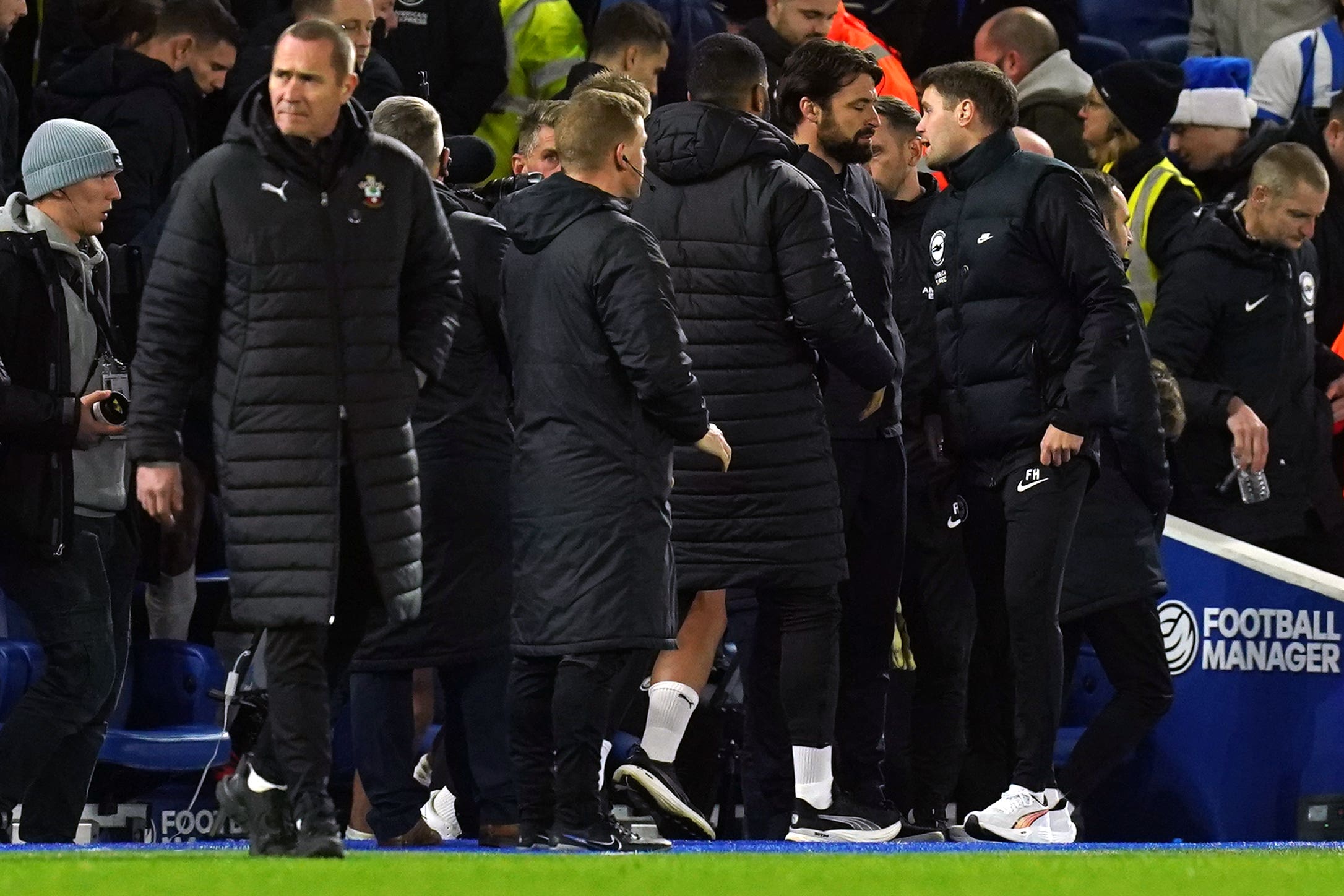 Brighton manager Fabian Hurzeler, far right, and Southampton boss Russell Martin exchange words at full-time (Gareth Fuller/PA)