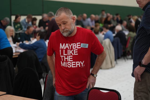 A member of the count staff as counting takes place at Nemo Rangers GAA Club in Cork (Jacob King/PA)