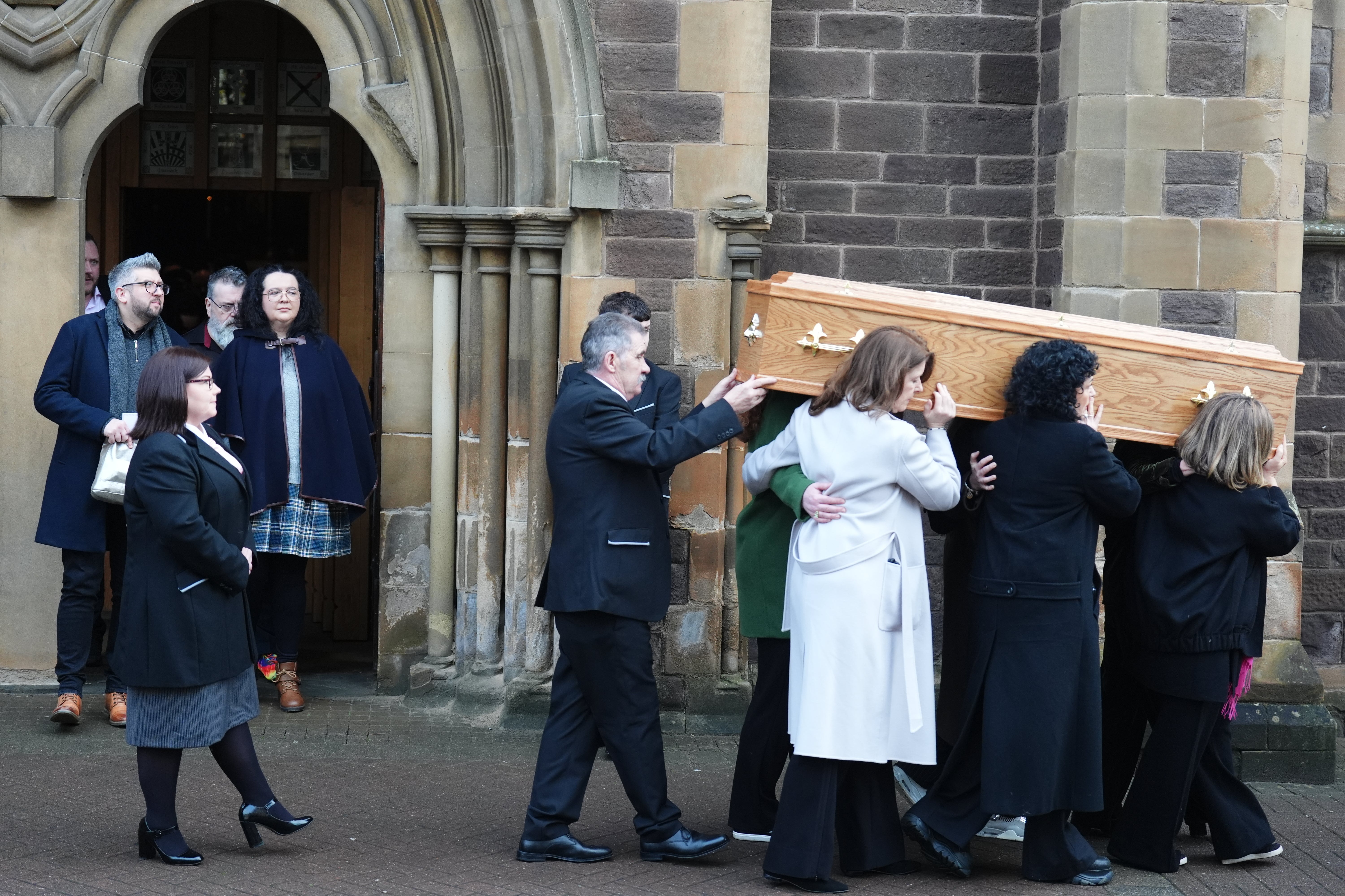 Godley’s coffin is carried out of the cathedral (Andrew Milligan/PA)