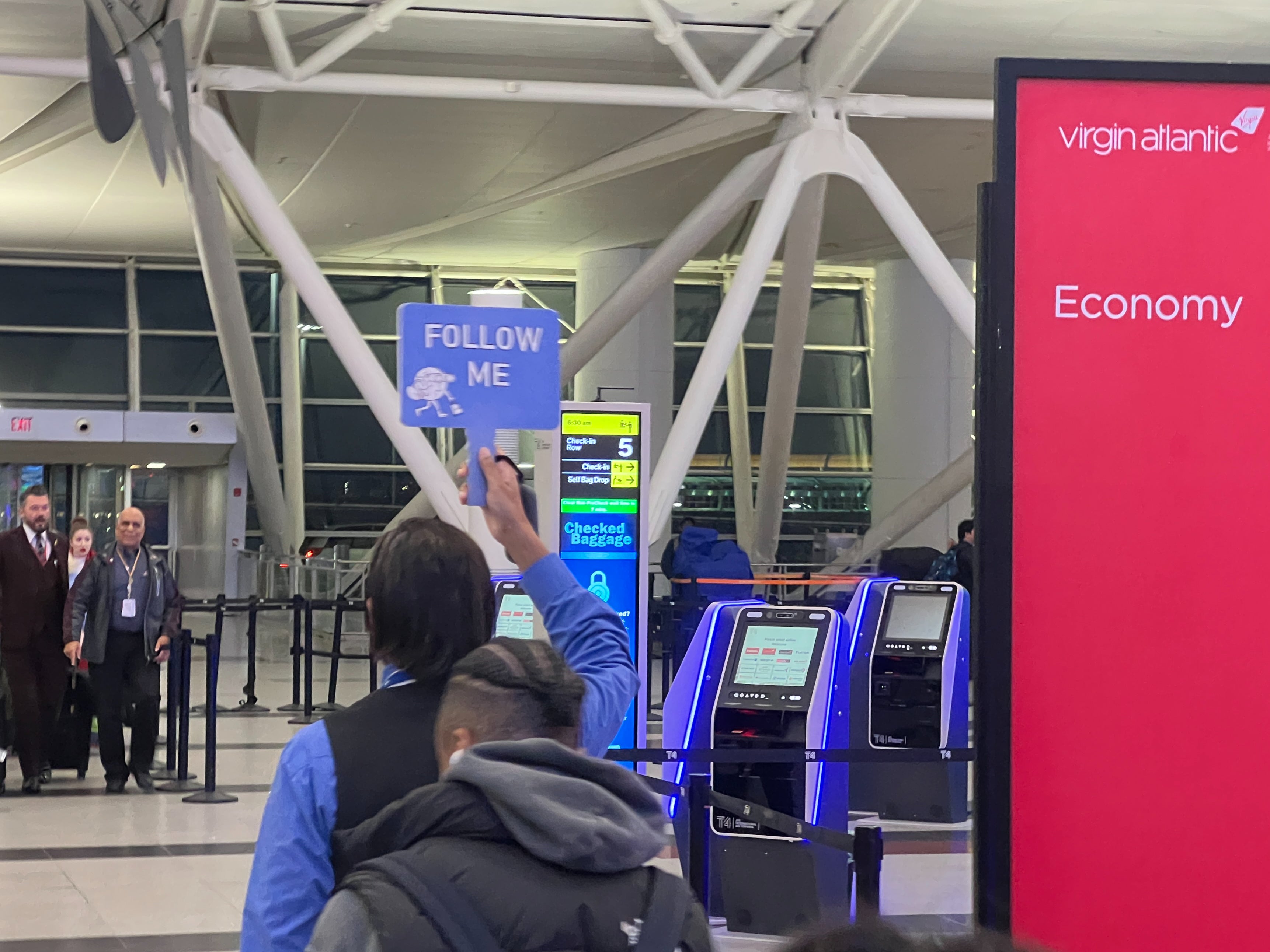 Follow my leader: The strange procession winding through JFK airport Terminal 4 on Friday morning