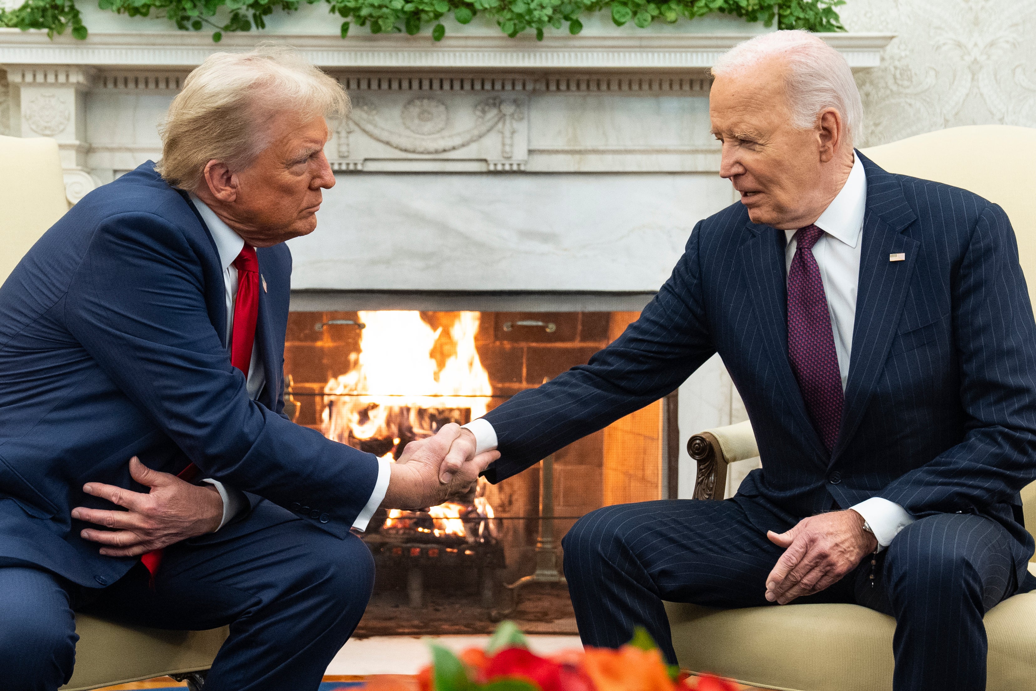 Donald Trump meets Joe Biden at the White House on November 13 last year