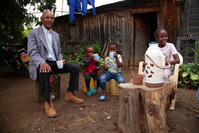 <p>David Mwangi Macharia, takes tea with his family in Rumuruti, Laikipia county, Kenya, Sunday, July 27, 2024</p>