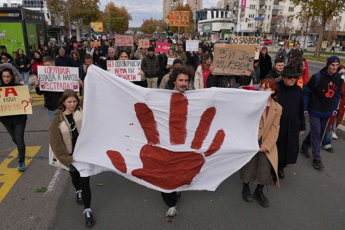 Thousands march in Serbia to mark 1 month since a roof collapse killed 15 people