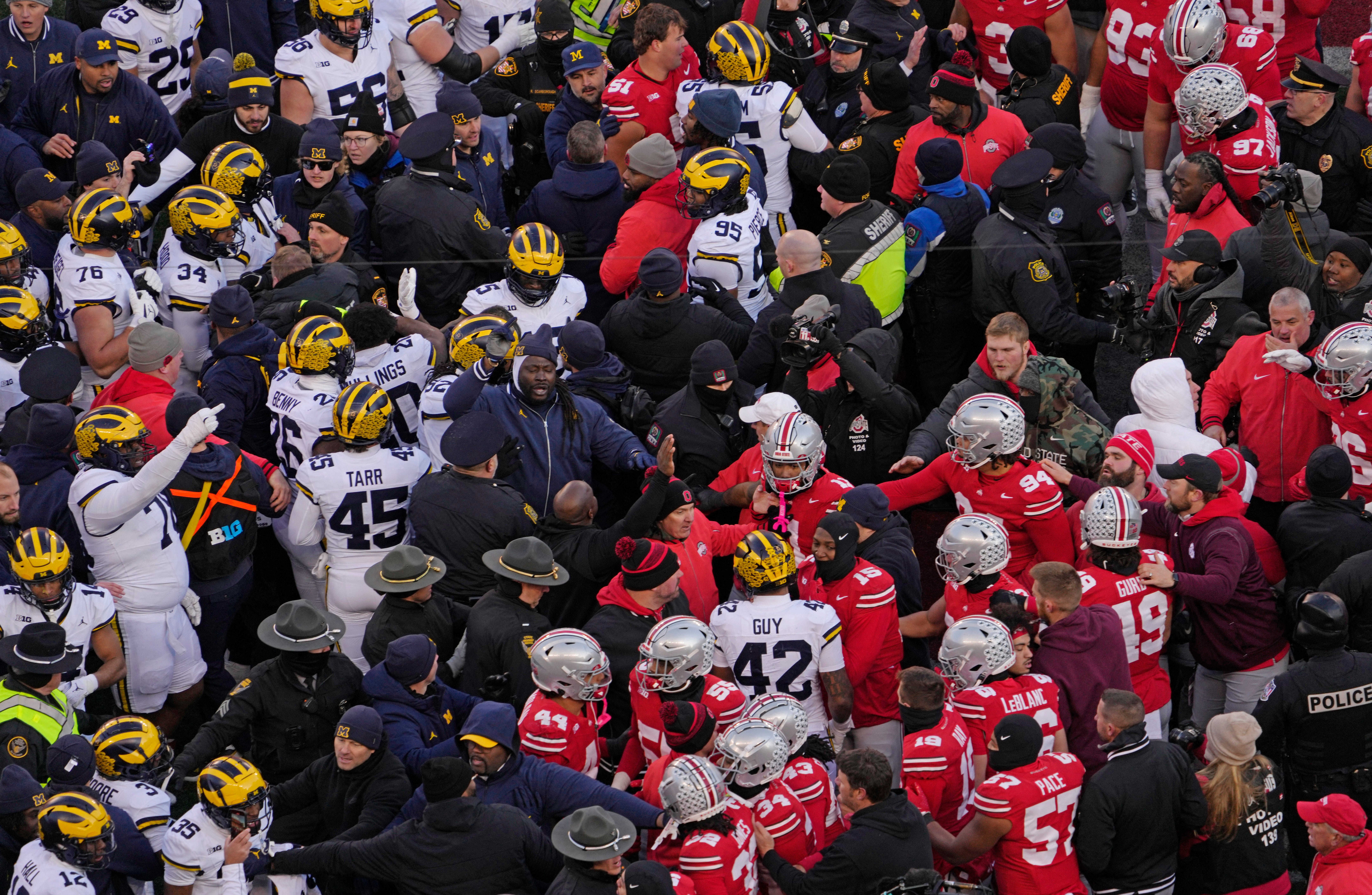 Police used pepper spray as Michigan and Ohio State players fought at the end of their game on November 30