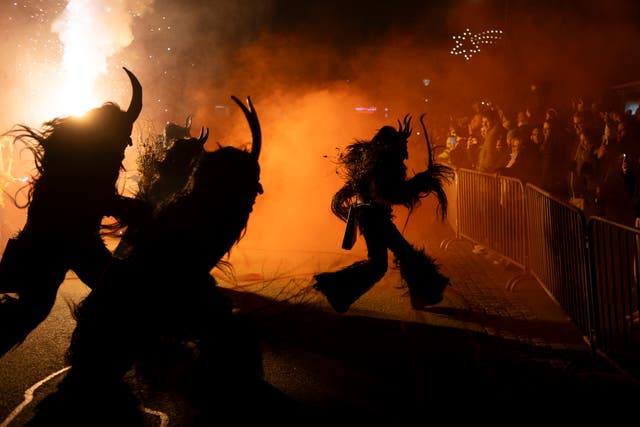 <p>Participants wearing traditional Krampus costumes perform during a Krampus run in Hollabrunn, Austria</p>