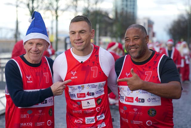 <p>Kevin Sinfield was joined on the start-line by former Everton star Peter Reid (left) and ex-Liverpool winger John Barnes (Peter Byrne/PA)</p>