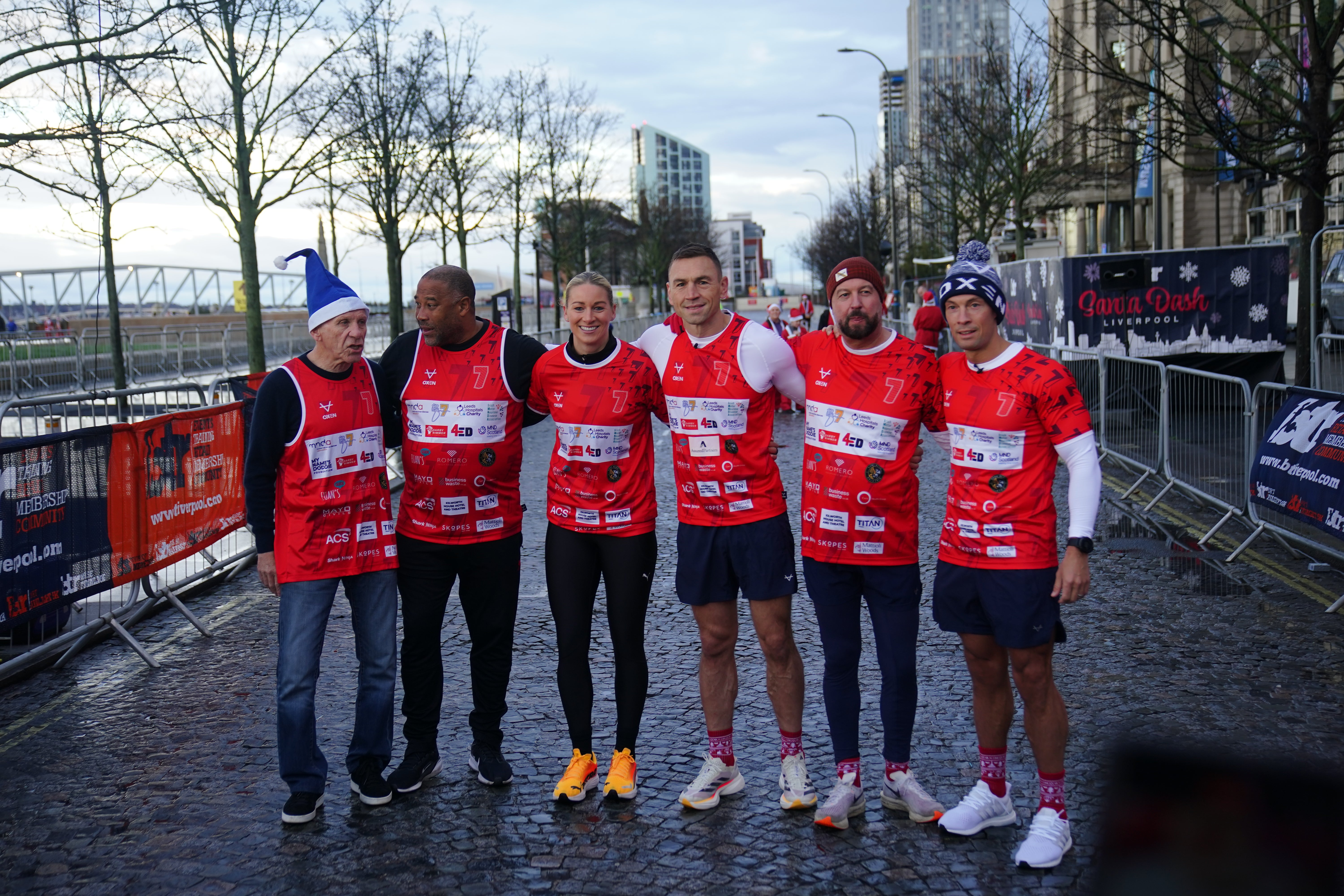 Kevin Sinfield (third right) with Peter Reid (left), John Barnes (second left), Liverpool FC Ladies Gemma Bonner, with his two support runners, before he starts his latest fundraising challenge