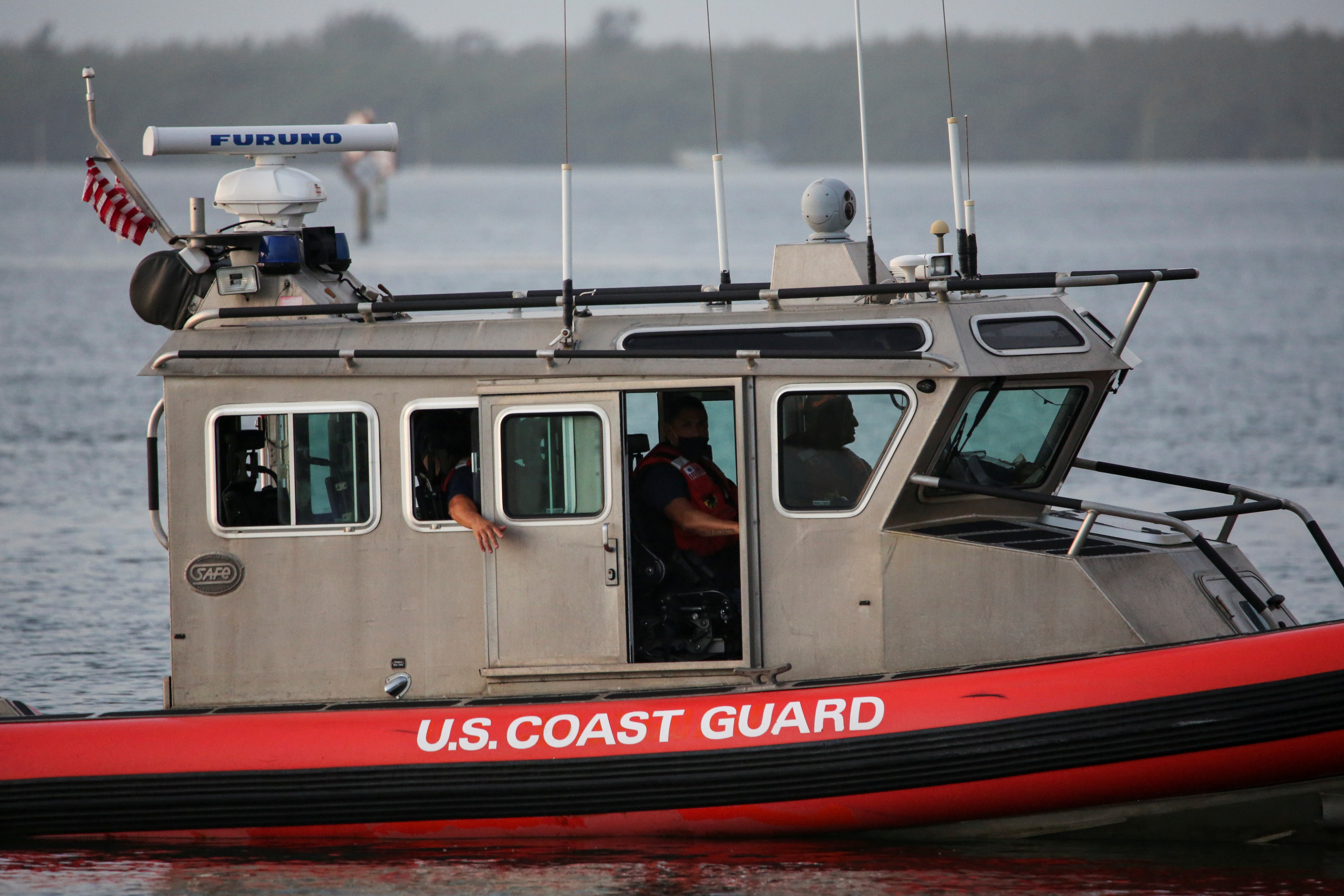 U.S. Coast Guard crews are searching for five people off the coast of Alaska