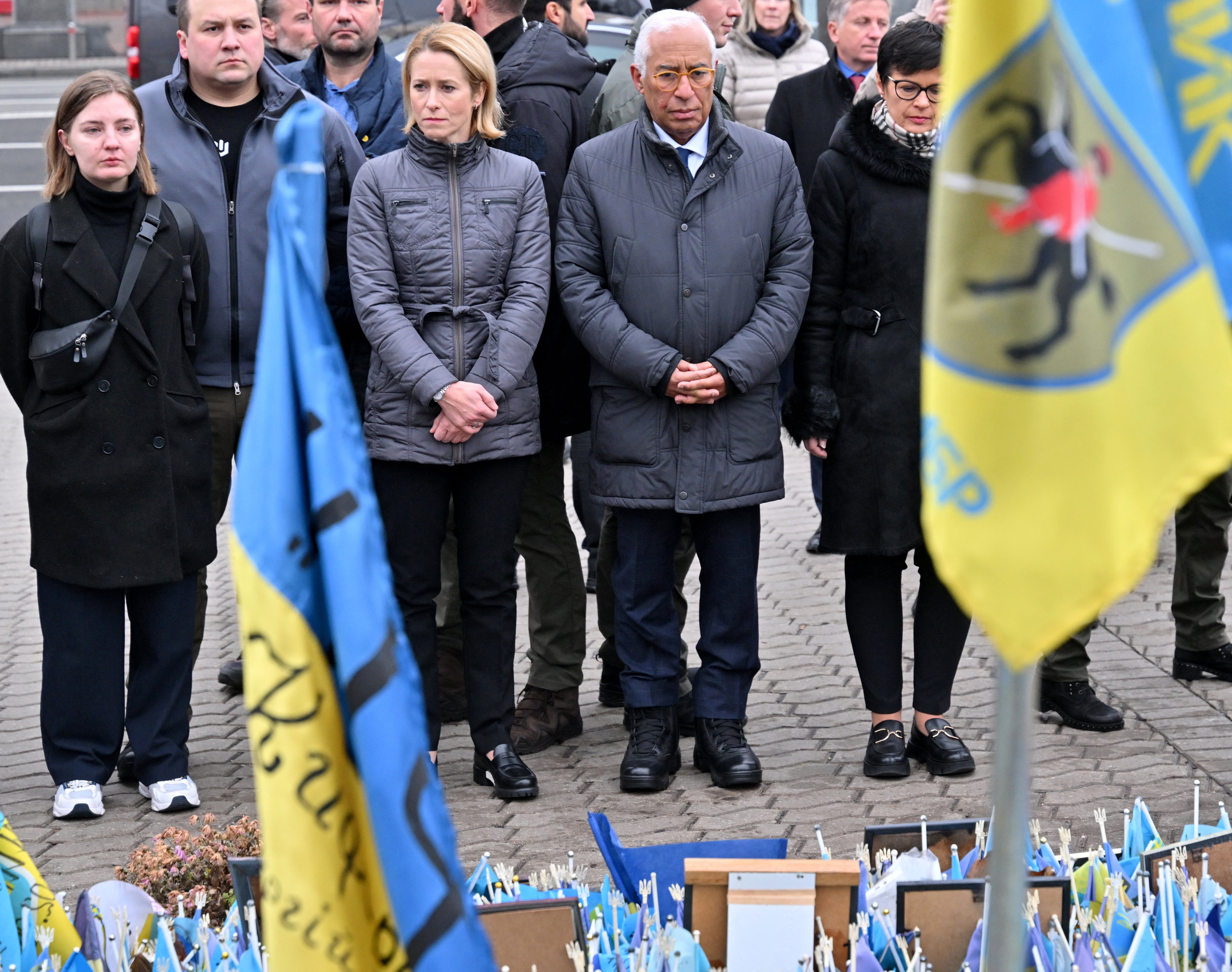 European council officials pay tribute to fallen Ukrainian soldiers at a makeshift memorial at Independence Square in Kyiv