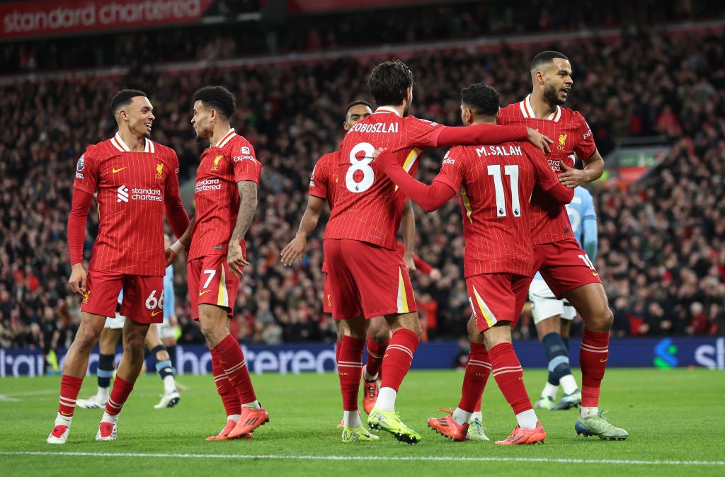 Cody Gakpo celebrates scoring Liverpool’s first goal against Manchester City with Dominik Szoboszlai and Mohamed Salah