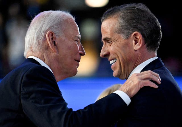 <p>Biden, pictured greeting his son Hunter at the Democratic National Convention in August, pardoned his second son on Sunday </p>