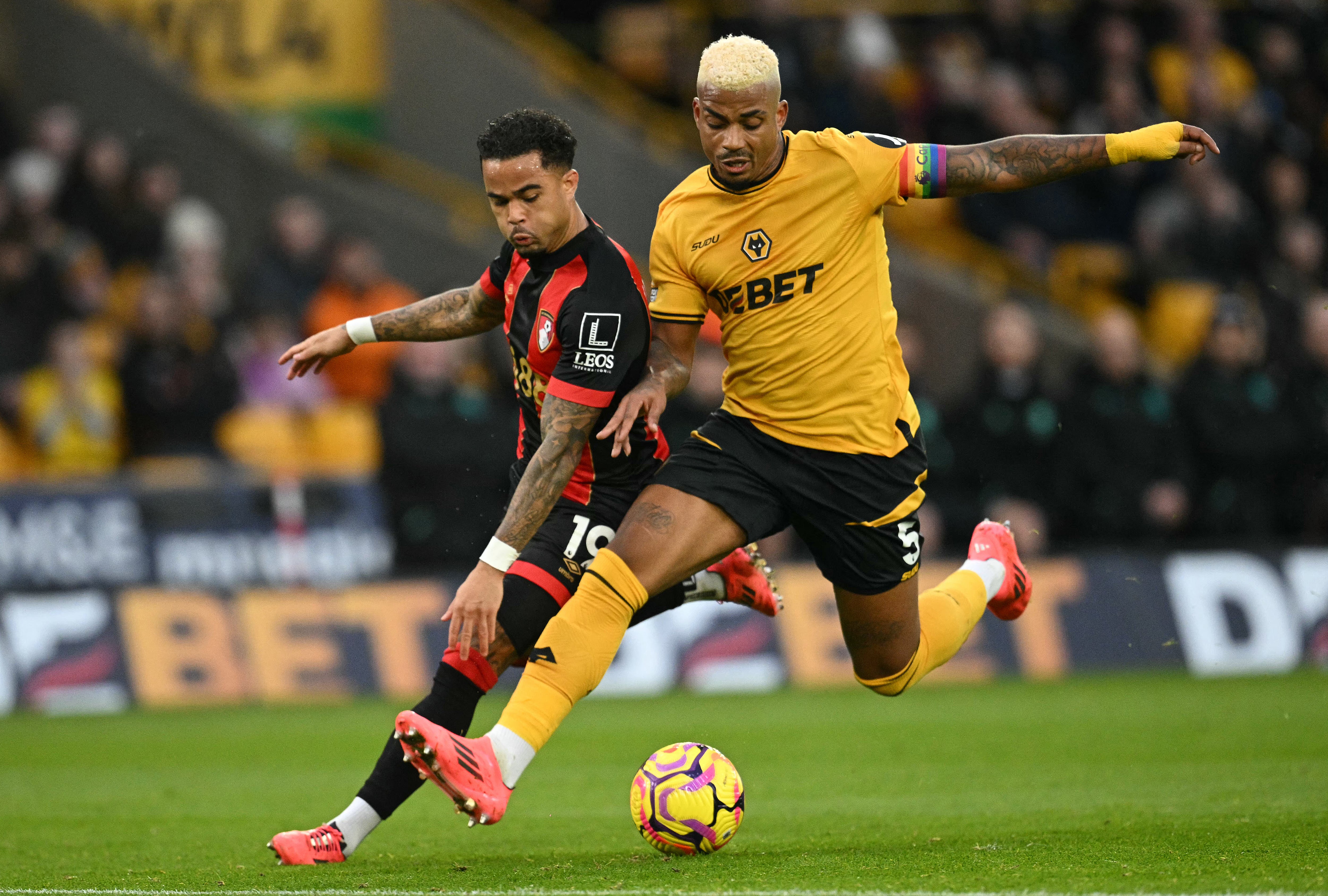 Wolves midfielder Mario Lemina tackles Bournemouth’s Justin Kluivert