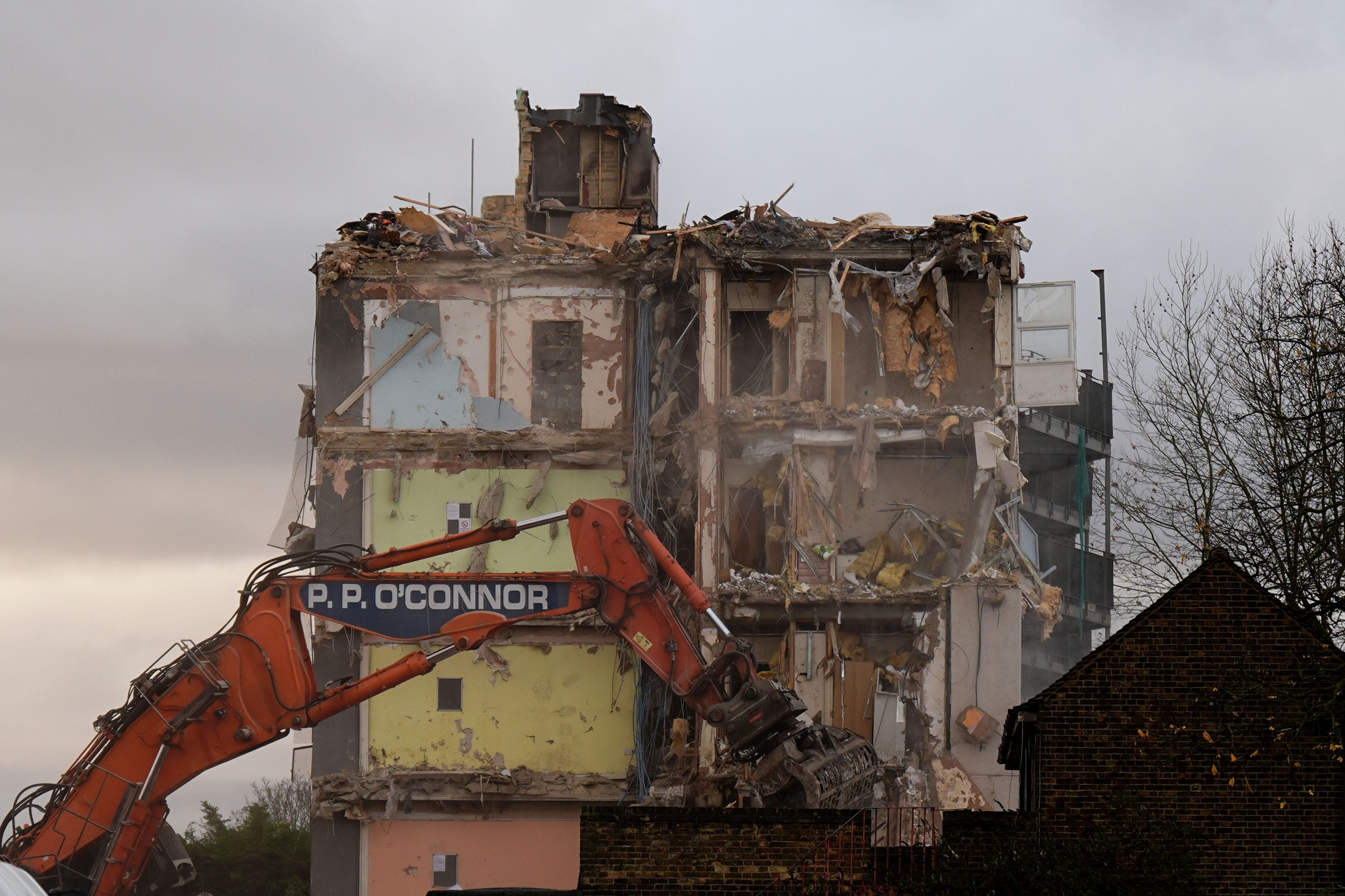 Demolition of the flats on Freshwater Road took place on Monday (Aaron Chown/PA)