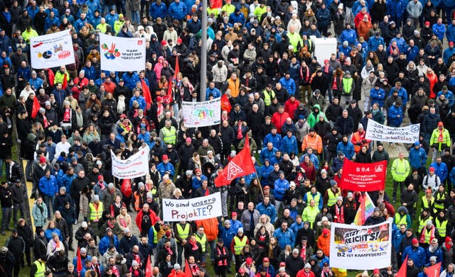 <p>Volkswagen employees attend a strike rally on the premises of the Volkswagen (VW) main plant in Wolfsburg, Germany</p>