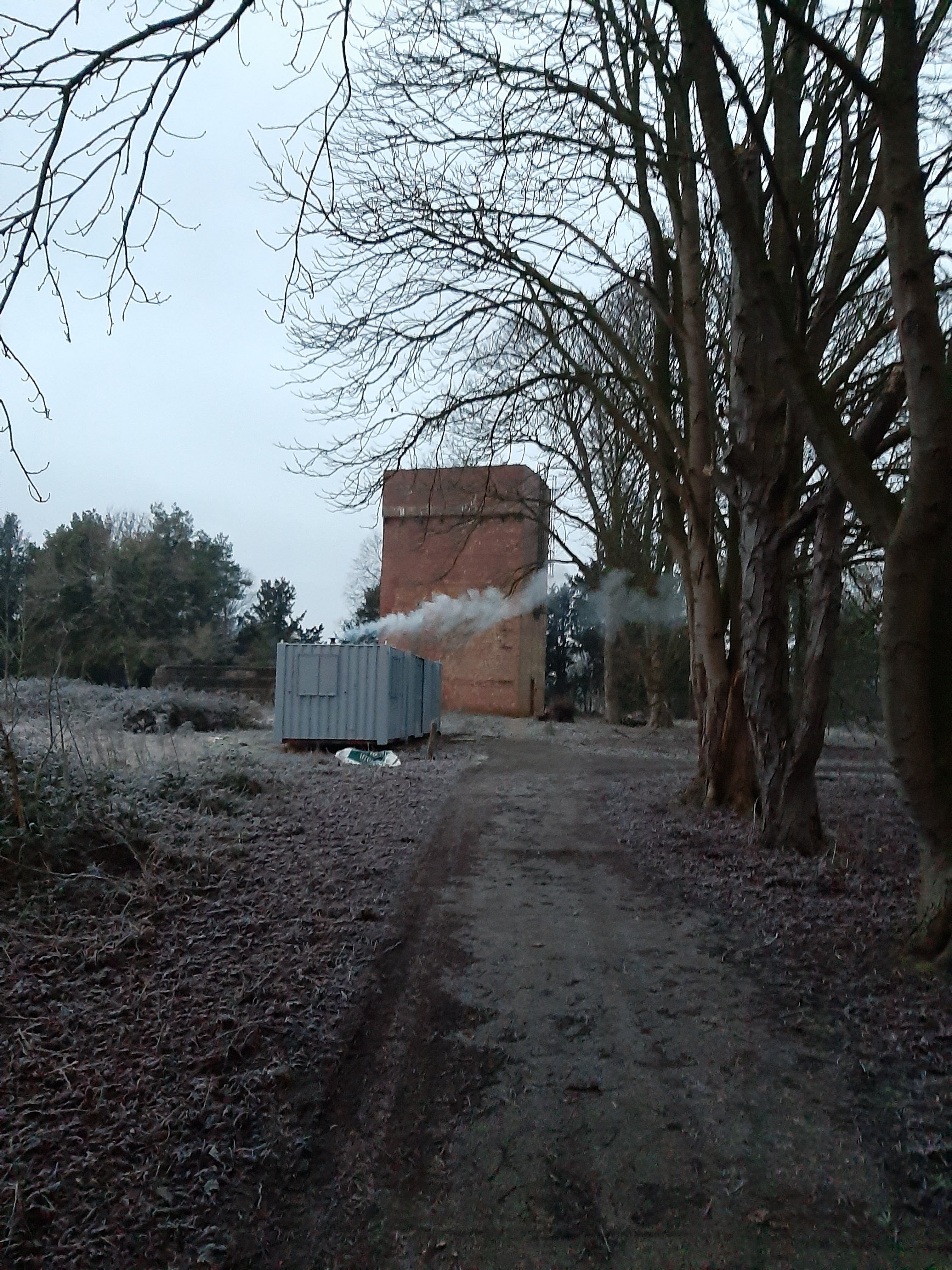 Smoke coming from the wood stove in the container they bought