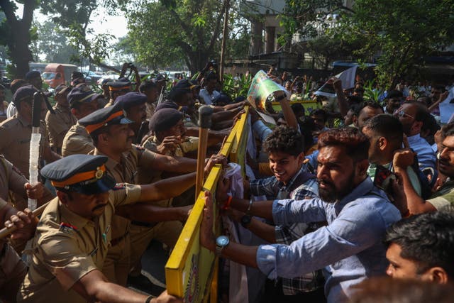 <p>Indian policemen block activists of the Bajrang Dal and the Vishva Hindu Parishad groups during a protest near Bangladesh’s mission in Mumbai, India</p>