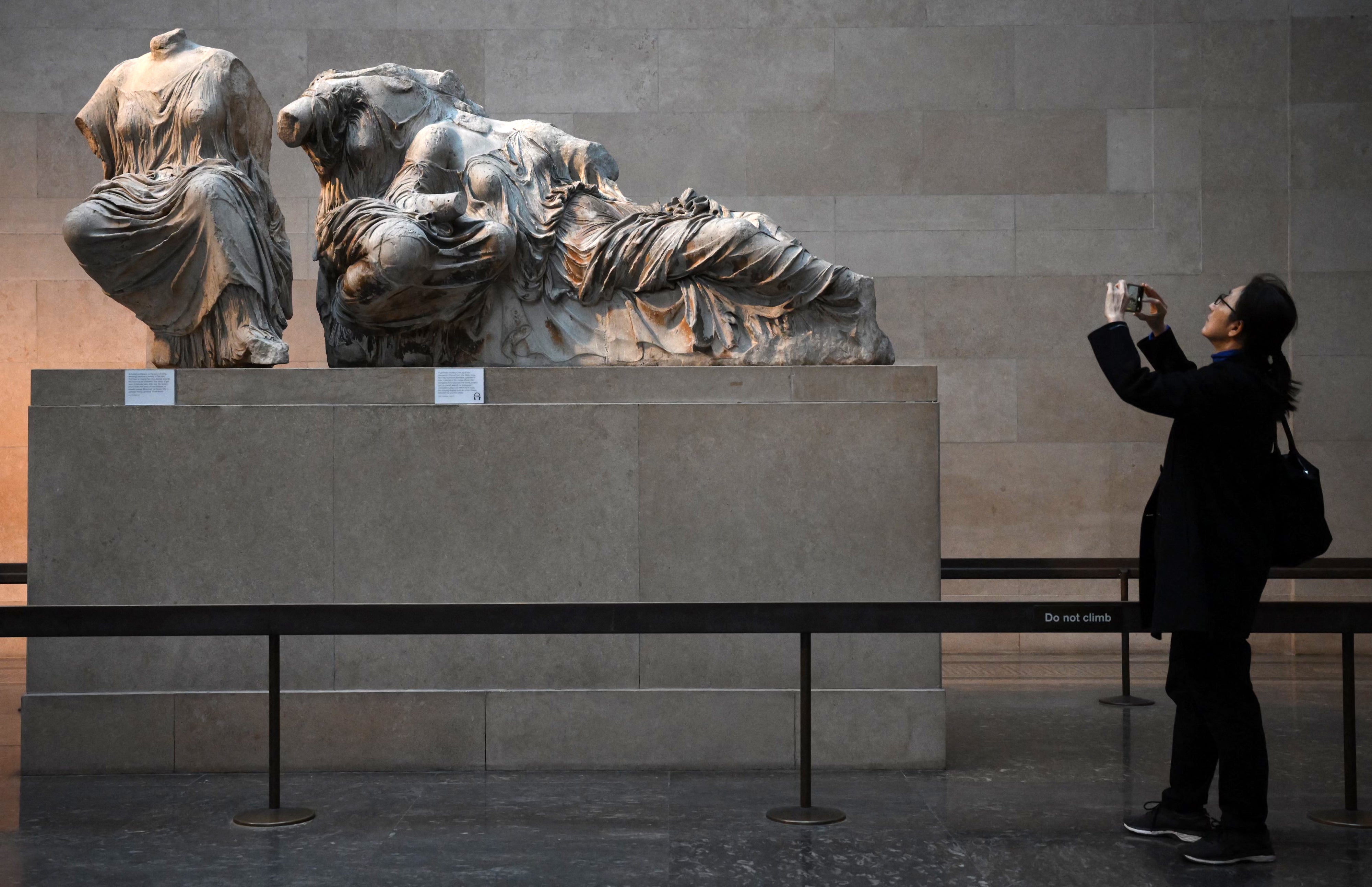 <p>Visitors view the Parthenon marbles at the British Museum</p>
