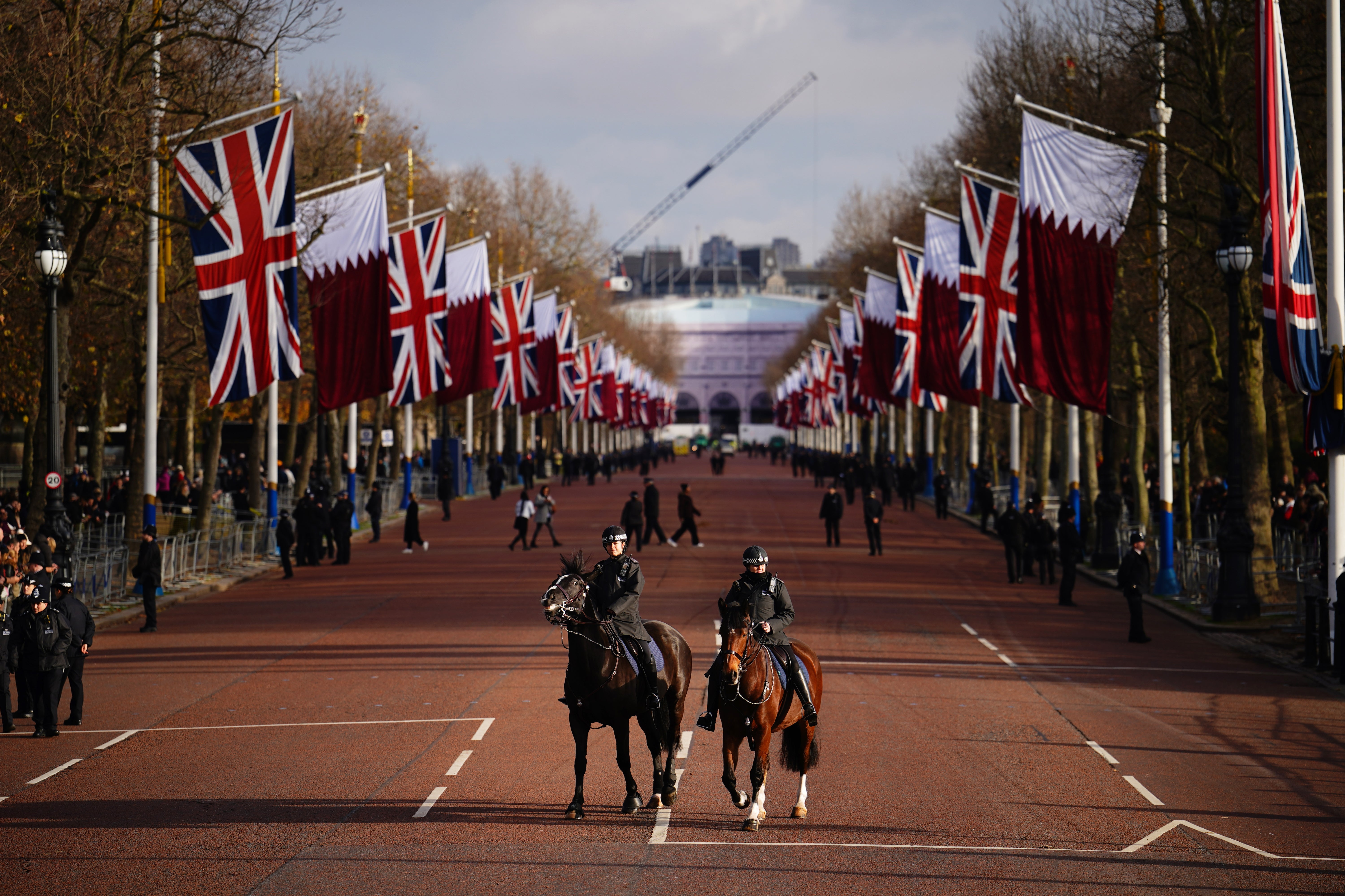 Police officers on The Mall in London during the state visit to the UK of the Emir of Qatar Sheikh Tamim bin Hamad Al Thani and his wife Sheikha Jawaher