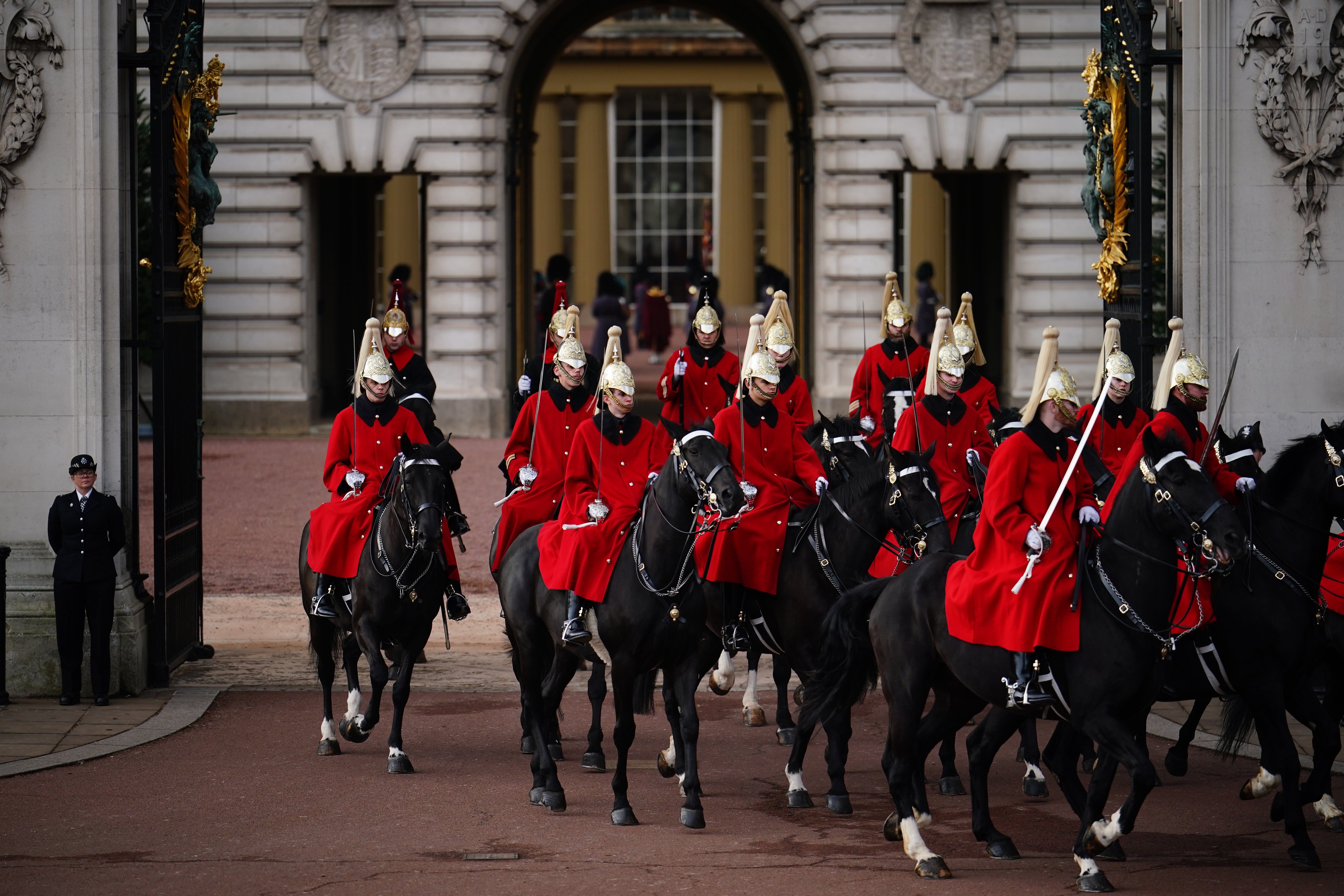 Life Guards leave Buckingham Palace in London following the ceremonial welcome