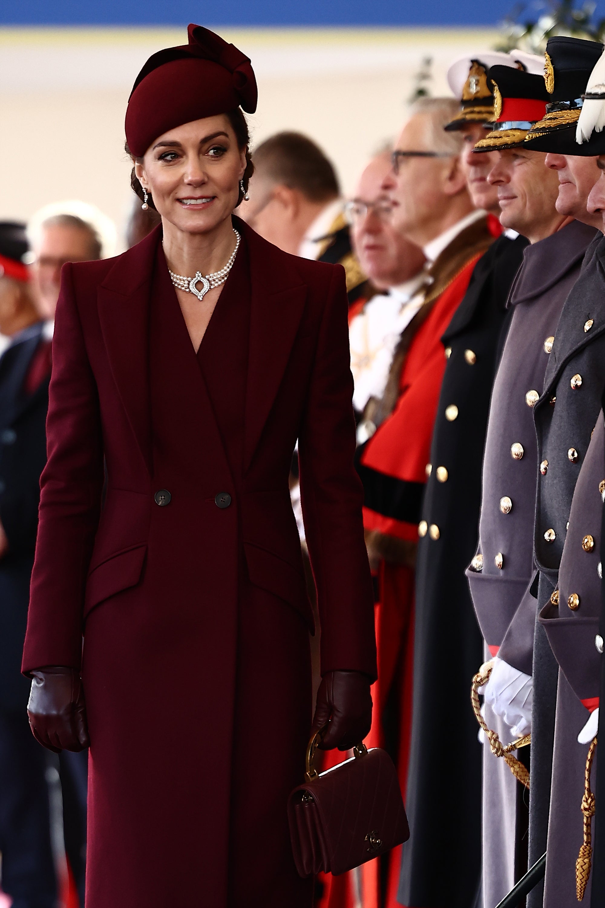 Kate let her family heirlooms shine against the dark palette of her ensemble