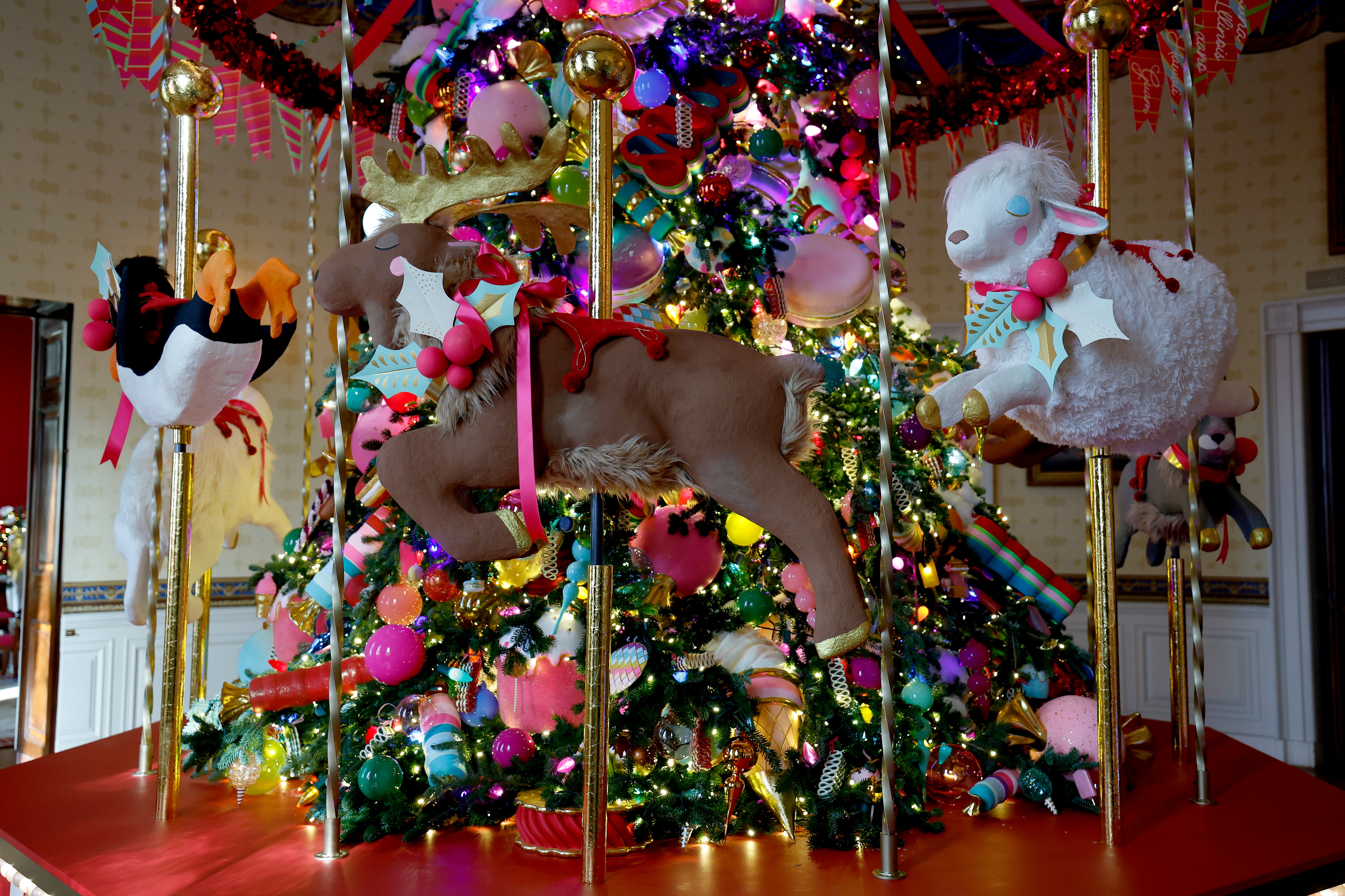 WASA carousel surrounds the White House Christmas Tree during a media preview of the 2024 holiday decorations at the White House on December 2 in Washington, DC.