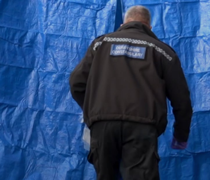 Officers scour the scene of the crash for clues