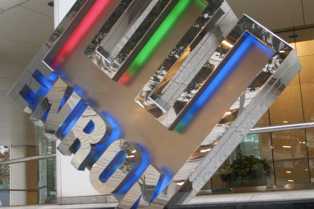 <p> The Enron logo is seen January 23, 2002 in front of the companys corporate headquarters in Houston, TX</p>