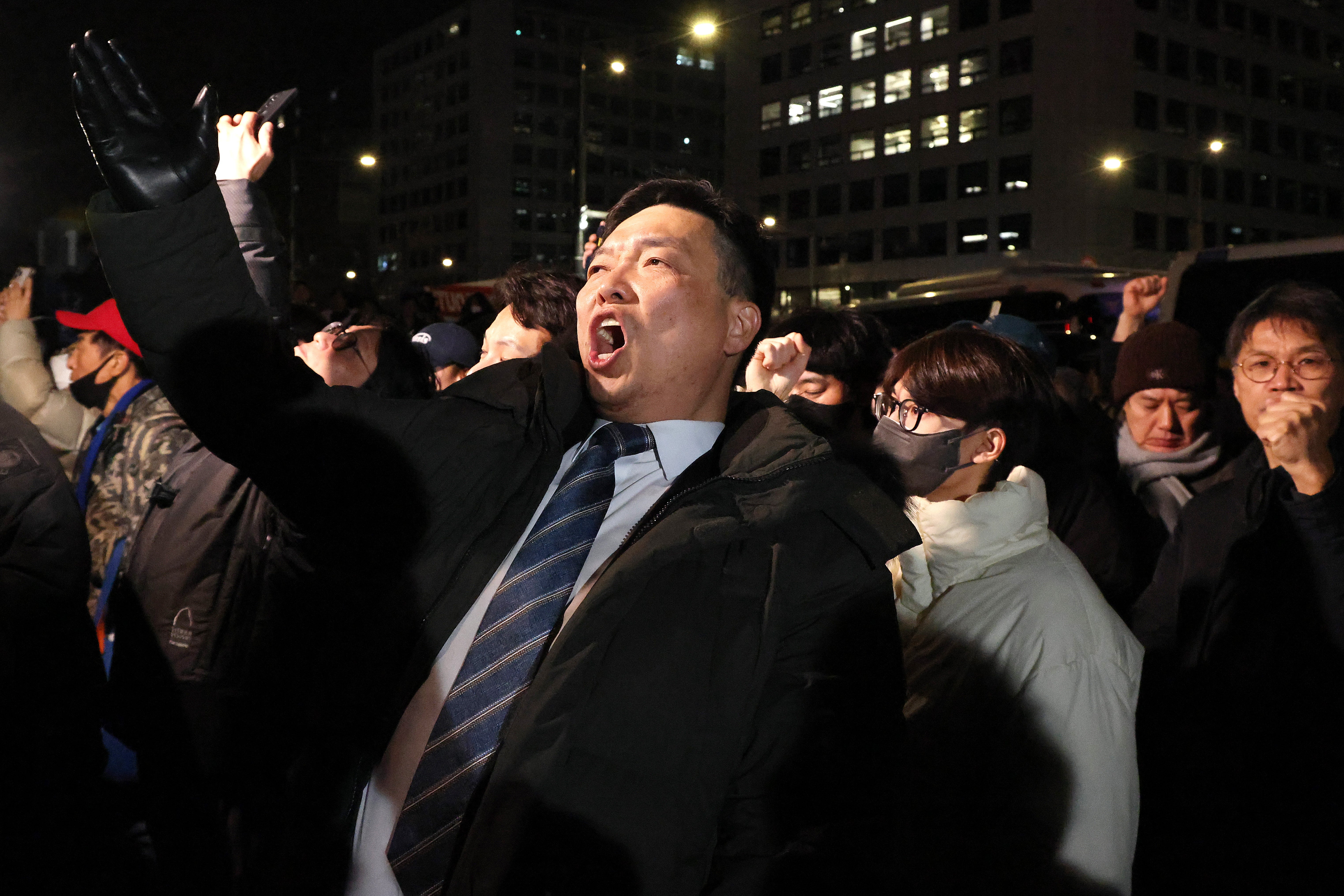 People protest outside the National Assembly after South Korean President Yoon Suk Yeol declared martial law