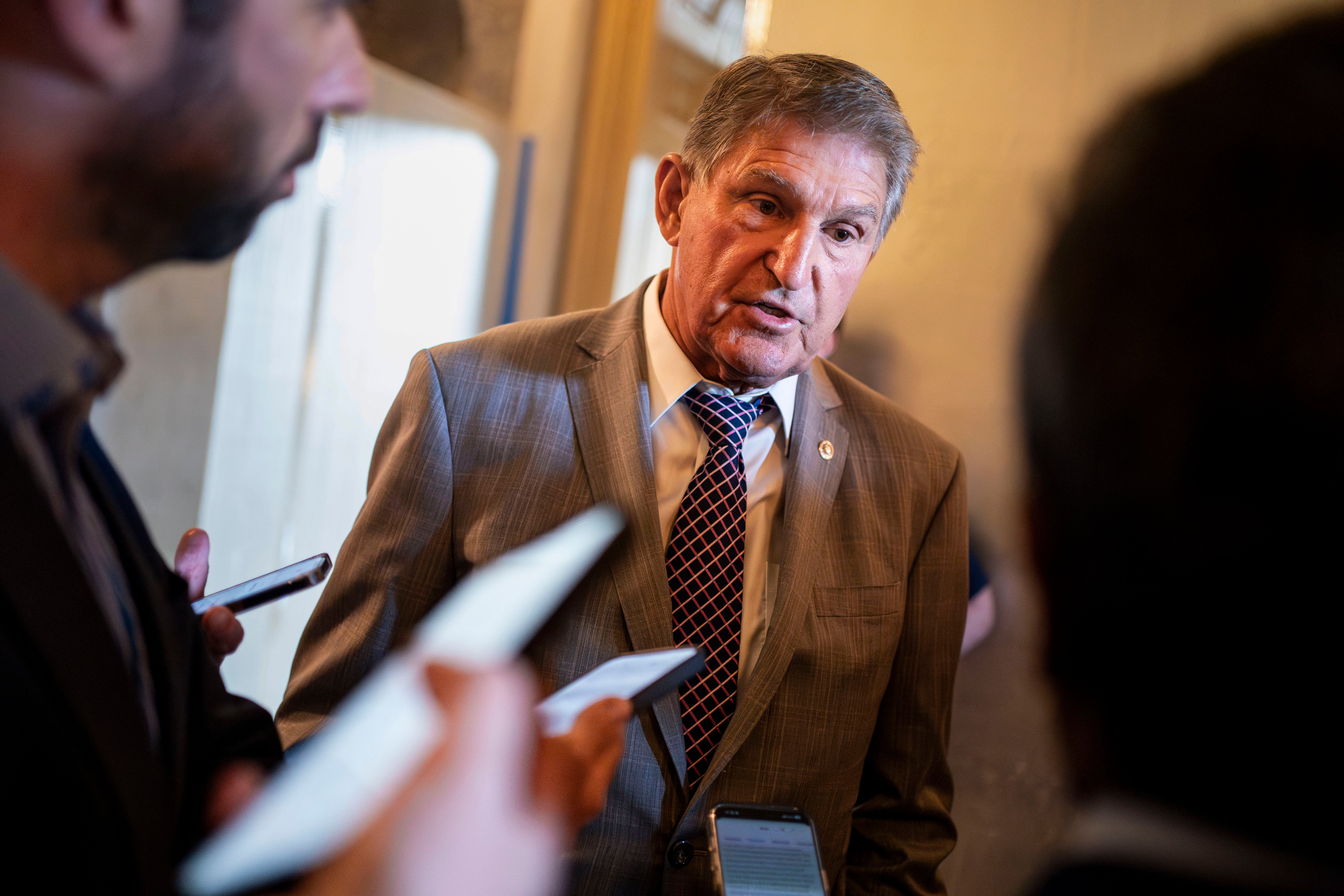 Sen. Joe Manchin speaks to reporters before an afternoon vote at the U.S. Capitol in Washington, DC, earlier this year. He has suggested that Joe Biden pardon Donald Trump