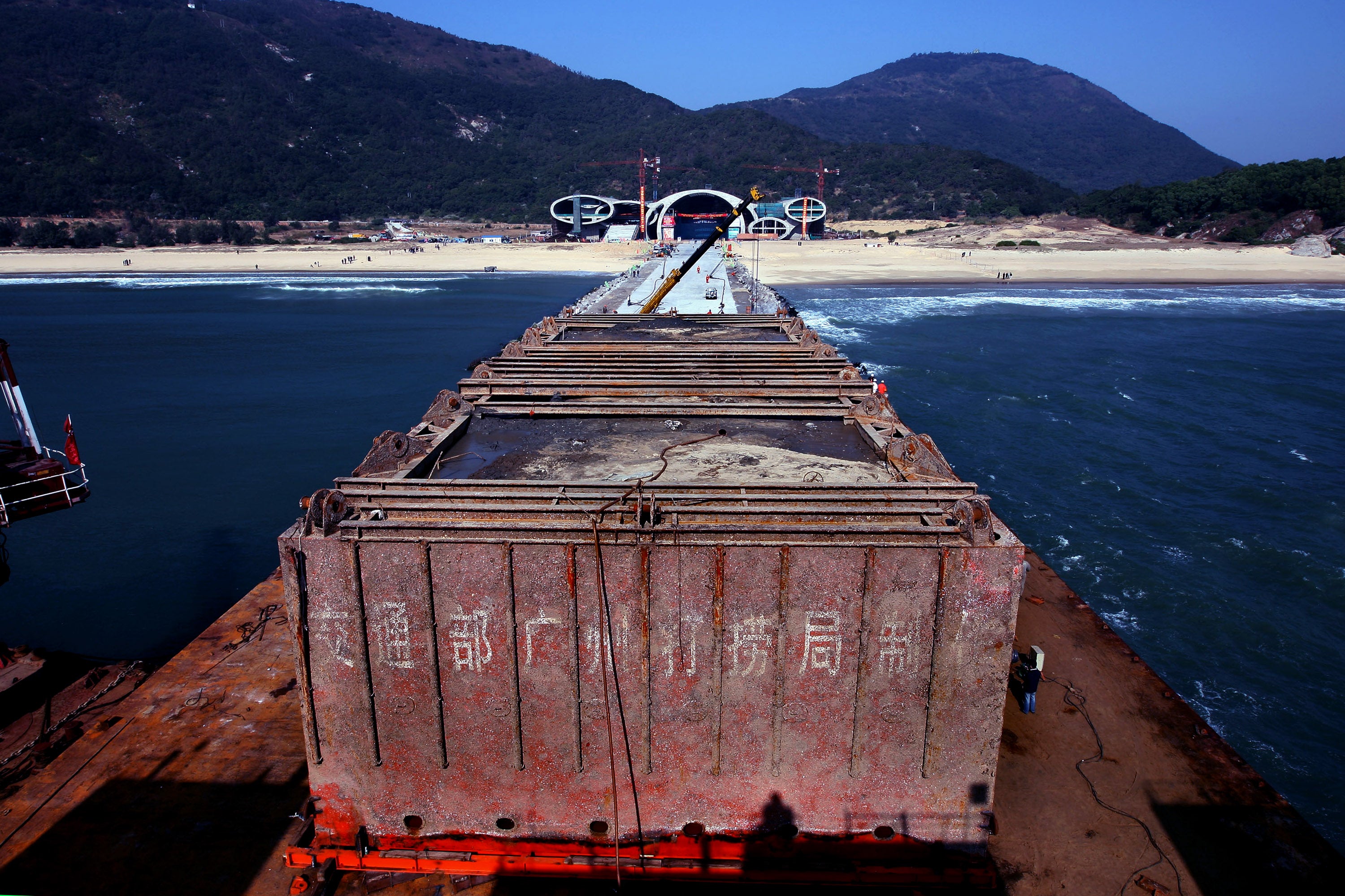 A barge carrying the wreck of the 800-year-old sunken merchant ship Nanhai No. 1 docks in December 2007 at the Silver Beach in Yangjiang, China. The ship is preserved at an aquarium in the Guangdong Maritime Silk Road Museum