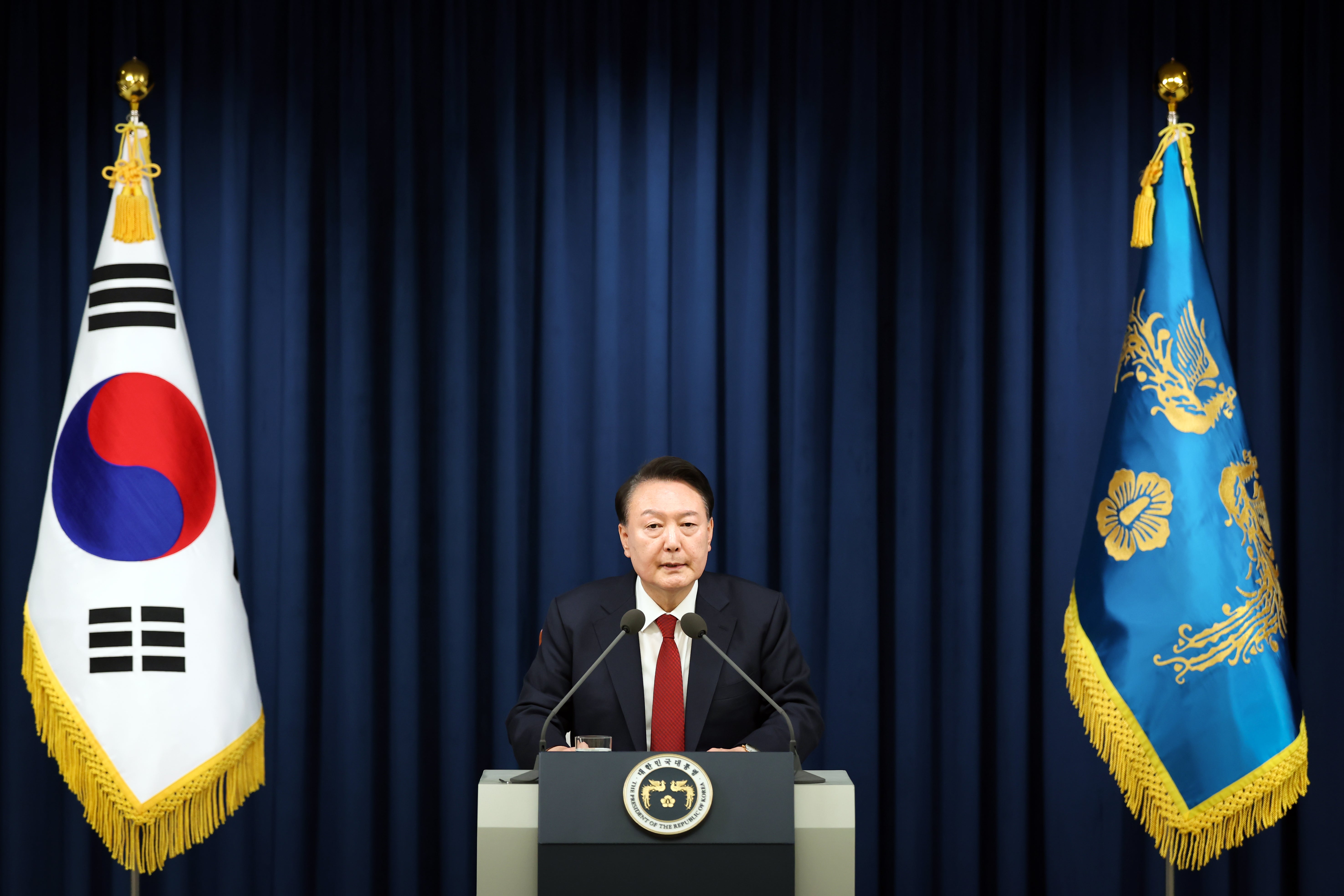 South Korean President Yoon Suk-Yeol speaks during the declaration of emergency martial law at the Presidential Office in Seoul, South Korea