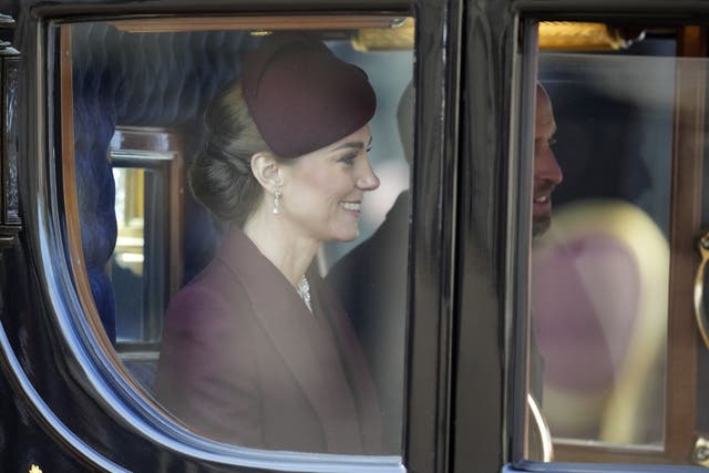 The Prince and Princess of Wales sit in a carriage after welcoming the Emir of Qatar and his wife to the UK (Kin Cheung/PA)