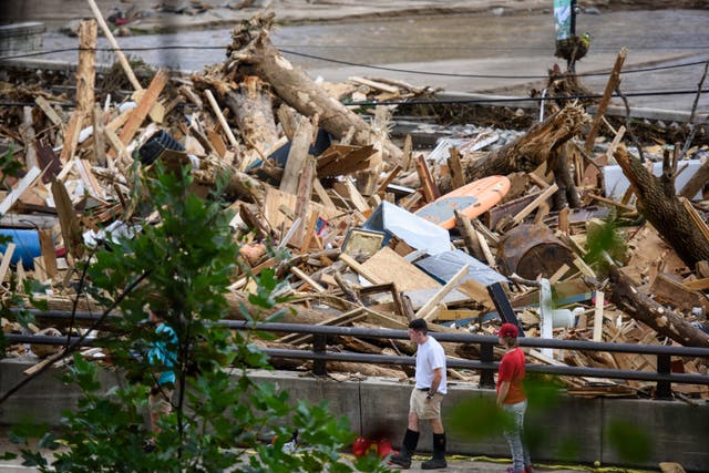 <p>The Rocky Broad River flows into North Carolina’s Lake Lure and overflows the town with debris after heavy rains from Hurricane Helene last September. Officials say the amount of debris they’ve collected could fill thousands of Olympic-sized swimming pools</p>