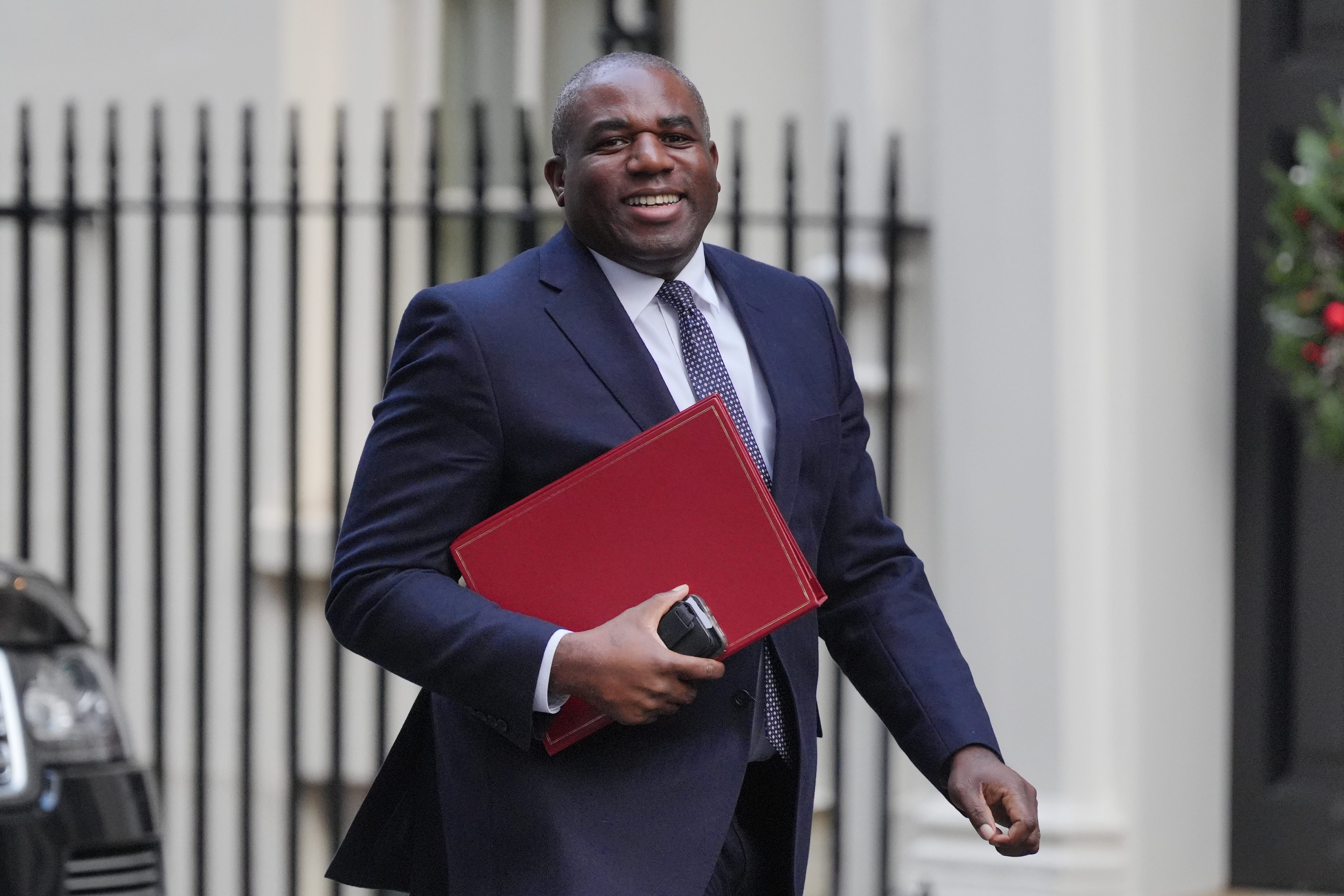 David Lammy arrives in Downing Street carrying a red ministerial folder