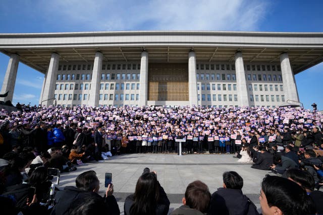 <p>Supporters of the main opposition Democratic Party stage a rally against president Yoon Suk Yeol at the National Assembly in Seoul on 4 December 2024</p>