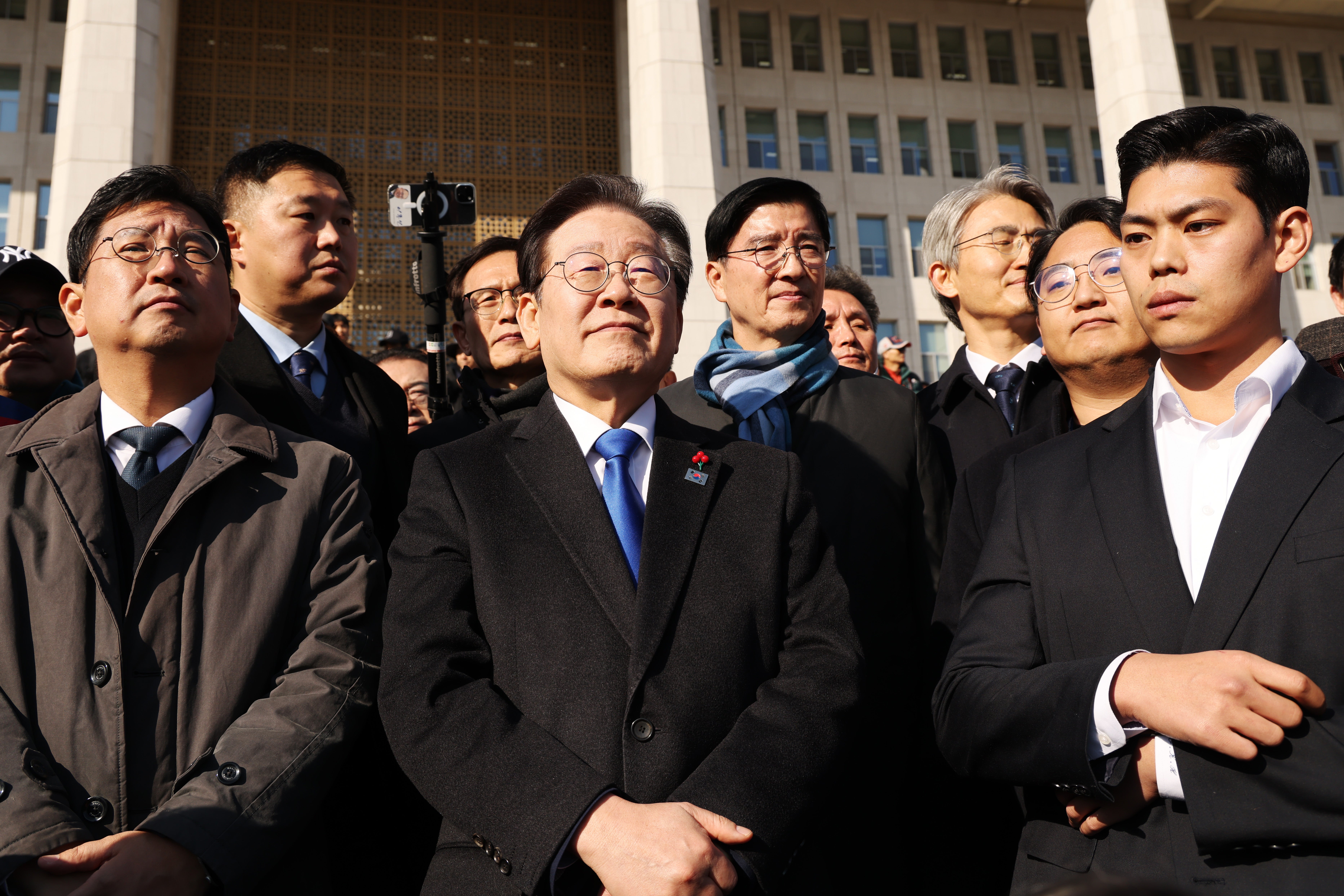 Democratic Party leader Lee Jae-Myung stands in front of the National Assembly in Seoul on 4 December 2024